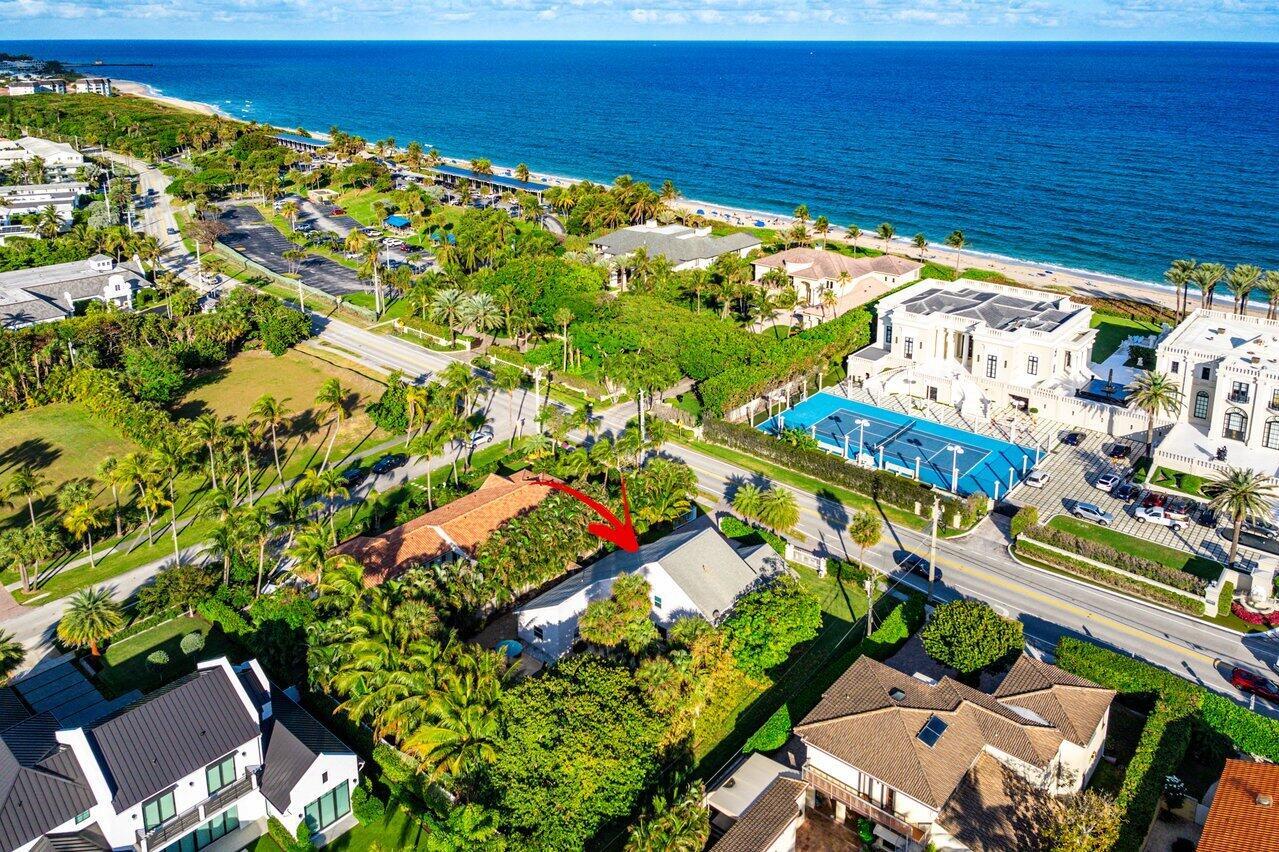 Nestled in the heart of Ocean Ridge, this stunning property offers the ultimate coastal lifestyle. Located on prestigious N Ocean Blvd and just steps from the pristine beach, this 4-bedroom, 3-bath home with a dedicated office is a perfect retreat. This updated home boasts 2,640 square feet of interior living space on a spacious 0.32-acre lot. Inside, you'll find an elegant blend of marble, bamboo, wood, and porcelain flooring, complemented by elegant finishes and a brand-new 2024 AC system. The heated chlorine pool is a centerpiece of the lushly landscaped backyard, complete with an outdoor fountain for added serenity. A comprehensive security system provides peace of mind. This coastal beach town is situated between Delray Beach and Palm Beach, this centrally located gem combines