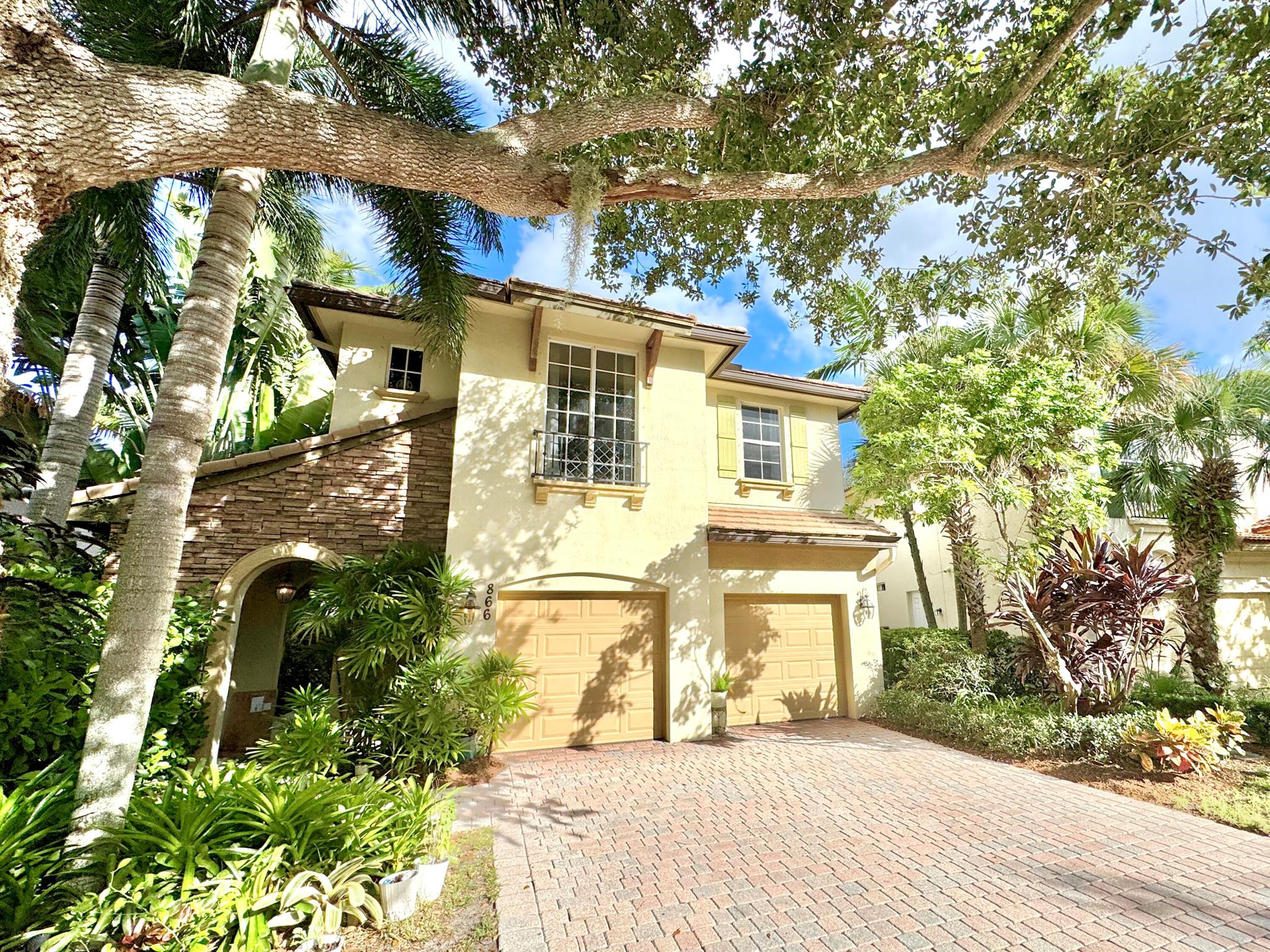 Discover the epitome of luxury living in this exquisite 3-bedroom, 2.5-bathroom home located in the highly sought-after Evergrene community of Palm Beach Gardens. This beautifully updated residence features a modern kitchen with elegant quartz countertops and premium gas appliances, perfect for culinary enthusiasts. The primary bathroom has been meticulously renovated to offer a spa-like retreat.Step outside the primary suite and enjoy the convenience of a spacious balcony overlooking the tropical-inspired back yard. Evergrene's resort-style amenities include gated entrances, a grand clubhouse with a sparkling pool, state-of-the-art fitness center, basketball and tennis courts, pickle ball courts, locker rooms, a children's playground, an aerobics room and much more.