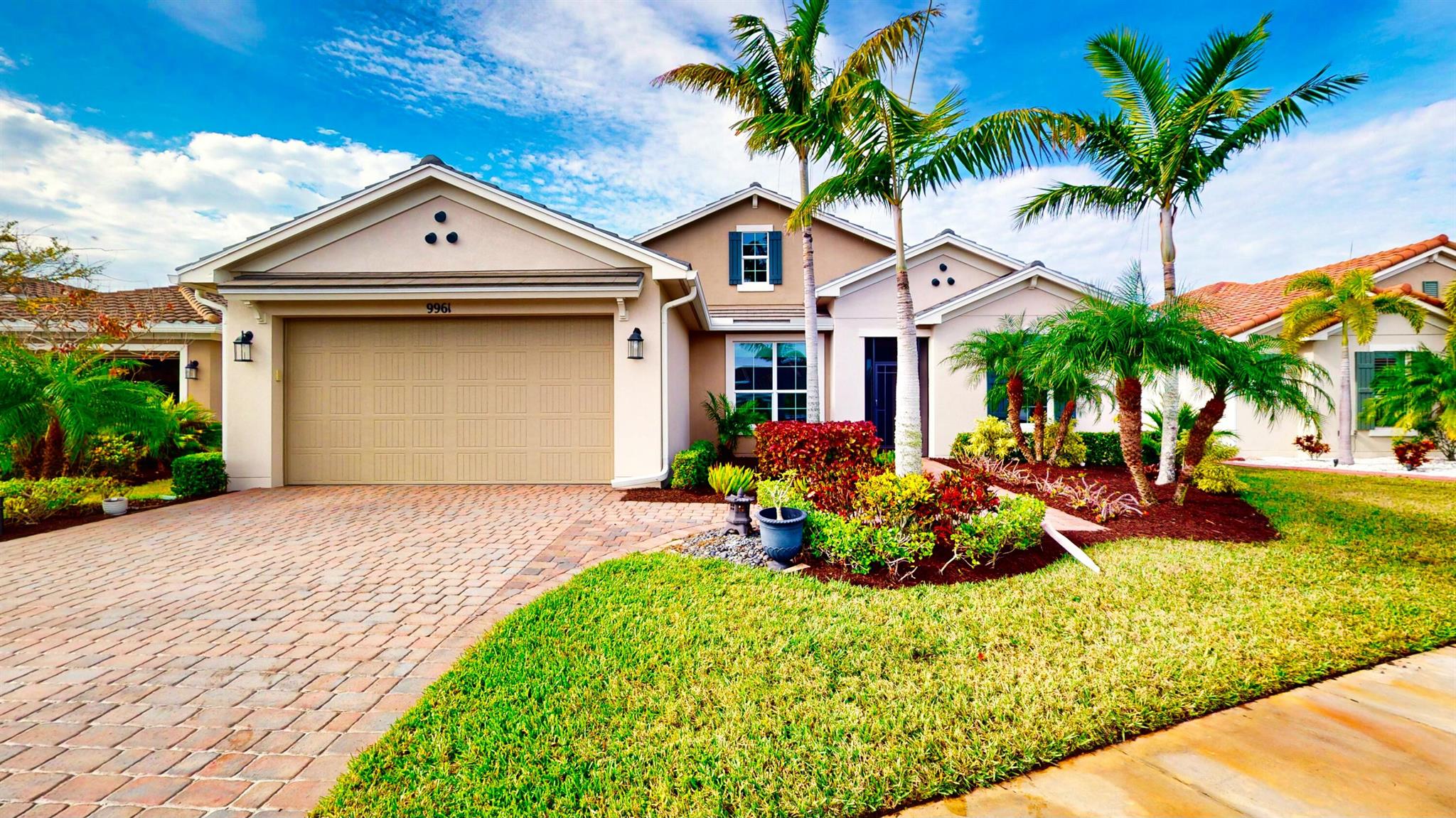 This stunning 3-bedroom, 3-bathroom home with a den offers over 2,200 square feet of luxurious living space. From the moment you arrive, the home's charm is evident, featuring a timeless tile roof, impact windows, and a decorative glass front door. Inside, the kitchen serves as the heart of the home, equipped with a large granite island, 42-inch cabinets, a stylish backsplash, and under-cabinet lighting, all overlooking the open and inviting family room. The expansive 16-foot sliders lead to a peaceful and private outdoor retreat, complete with a sparkling pool and a spacious lanai surrounded by lush, upgraded landscaping for ultimate privacy. The home includes dual master suites, each with a massive walk-in closet, his-and-her sinks, and a stand-up shower, offering comfort and convenience. The third bedroom is oversized and positioned separately, with the third bathroom nearby, providing an ideal setup for guests. A large den offers flexibility as a home office, gym, or additional living space. This home combines elegance, practicality, and outdoor tranquility in one perfect package.