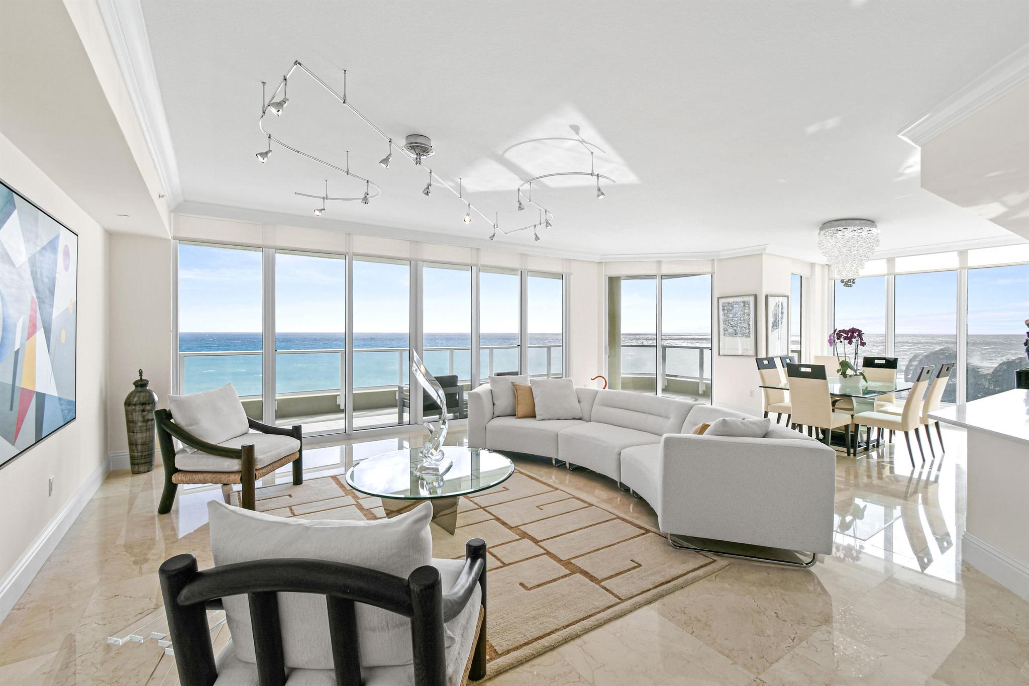 Experience ultimate coastal living and panoramic views in this stunning fifth-floor residence at Ocean's Edge, an exclusive gated community on Singer Island. This rare floorplan boasts 3-bedrooms, 3.5-baths and spans over 3,100 square feet, featuring a thoughtfully designed layout that maximizes light, space and breathtaking vistas. This luxury home flows from eastern ocean views, to southern skyline views, and all the way through to the western view of Florida sunsets and the Intracoastal Waterway. Arrive via private elevator to a beautifully renovated home, blending modern elegance with coastal charm, and a wall of windows with stunning views from every room. The open-concept kitchen is the heart of the space, updated in 2023 with Italian Irpinia soft-close cabinetry, quartz countertops, Miele appliances, a Wolf five-burner gas cooktop and Sub-Zero refrigerator and wine storage. The gourmet kitchen flows seamlessly into the living area, opening to a travertine-clad oceanfront balcony where you can savor the sunrise, ocean breezes and listen to the sound of waves.

The primary suite is a serene retreat with captivating ocean views, a spa-like bathroom featuring a Jacuzzi tub and walk-in shower, and a custom walk-in closet. Two guest suites offer private en-suite baths, tranquil Intracoastal views and abundant natural light, from southeast exposure.

Ocean's Edge offers a curated lifestyle with luxury amenities, including a heated oceanfront pool and spa, private cabanas, an outdoor grill area, a newly renovated fitness center, a private movie theater, and direct boardwalk access to Singer Island's pristine beaches. Concierge services, 24-hour gated security, and controlled-access parking ensure peace of mind.

Conveniently located near John D. MacArthur Beach State Park, championship golf courses, and the upscale shopping and dining of Palm Beach Gardens and Worth Avenue, this residence delivers the best of coastal and luxury living.