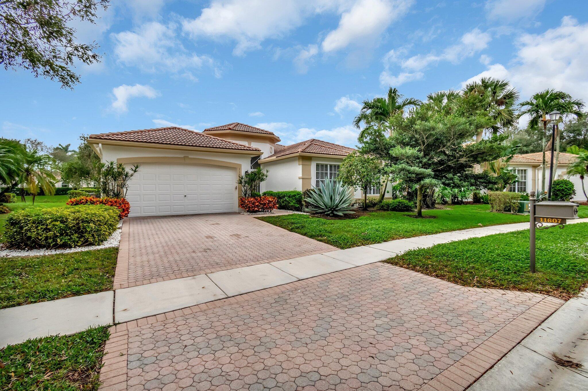 Welcome to 11607 Puerto Boulevard, a haven set in the posh locality of Boynton Beach, FL. This superbly maintained estate gloriously stands on an exquisite lakefront lot that enjoys a Southern exposure, promising delightful vistas throughout the day. The property features a heated pool, meticulously screened for privacy, and an inviting Jacuzzi that comfortably accommodates up to six people. The property's distinctive ease of living is further enhanced by a considerable easement on one side, expanding your sanctuary of solitude. Stepping onto the extended patio, one is greeted by a captivating herringbone-laid tile that offers an ideal space for entertaining guests and outdoor barbecues. The entire estate can be purchased as a fully furnished marvel as it houses designer window treatments, custom furnishings, and a well-curated collection of artwork.

The exterior, recently repainted, shines with quiet sophistication, while the well-serviced interior boasts a staggering attention to detail, lovingly upheld by its dedicated owners. Upon entry through the double doors, the home opens up into a spacious domain punctuated by vaulted ceilings, instilling an immediate sense of grandeur.

At its heart lies a pristine white kitchen, equipped with state-of-the-art stainless steel appliances and an innovative integration of glass blocks in the backsplash, turning everyday cooking into a joyous experience. The master bedroom beckons rest and relaxation with an elevated tray ceiling, a cozy sitting area, and two spacious walk-in closets that pledge ample storage.

Nestled within an upscale gated community, this property alludes to a remarkable lifestyle, complete with a lakefront caf+¬ and a cutting-edge clubhouse. This abode is not just a spectacle but an experience that must be seen and savored. Residents are promised a paradise for peace and privacy at 11607 Puerto Boulevard. Enjoy living in what is obviously a product of meticulous planning and astute construction, where every day seems like a vacation. Welcome home.