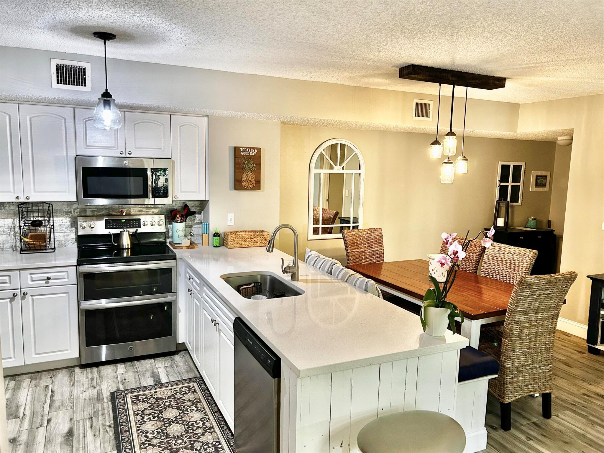 SELLER MOTIVATED! Fully remodeled unit within the resort style community of Lighthouse Cove in coveted Village of Tequesta! Beach cottage inspired 2/2 unit, split floor plan, new porcelain wood plank flooring throughout, new quartz kitchen & bathroom countertops, stainless steel kitchen appliances, unique bench seating with storage in dining area, newer hot water heater (2017) & AC (2019), new lighting fixtures & a completely updated 2nd bathroom.  Both bedrooms have ensuite bathrooms with custom walk in closets.  Master Bedroom boasts custom shaker molding & shelving.  Accordion hurricane shutters & NEW ROOF in 2022.  All legally required engineering reports were completed in 2024, resulting in a reduction in HOA dues!!  Come live the ultimate Florida lifestyle & enjoy the lavish tropica heated pool &amp; spa area with a tranquil waterfall.  Entertain using the outdoor covered tiki hut with bar area, tables &amp; chairs, BBQ grills, tennis/pickleball courts &amp; a sand volleyball pit.  The clubhouse contains a fitness center, billiards room, an indoor racquetball court, library, business center &amp; the on site manager.  This home is move in ready &amp; convenient to Publix, shopping and a multitude of retail establishments &amp; restaurants!!