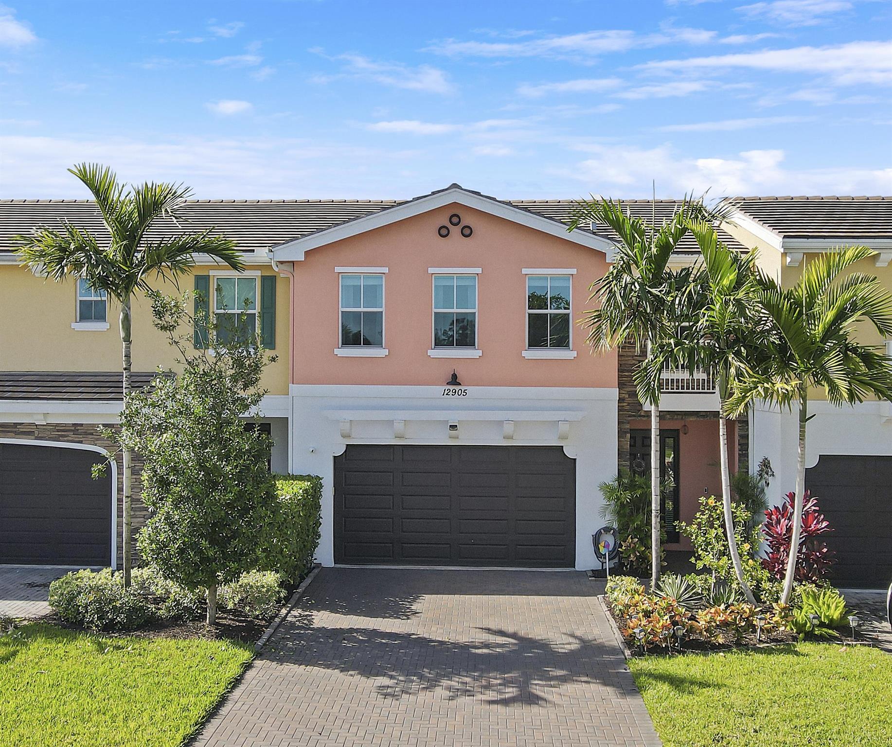 Welcome to 12905 Trevi Isle, a stunning townhouse nestled in the heart of Palm Beach Gardens. This exquisite residence offers 1,932 sq ft of thoughtfully designed living space, featuring 3 spacious bedrooms, an upstairs loft space, perfect for an office, and 2.5 bathrooms. Step inside to discover architectural elegance with high ceilings that create an airy and sophisticated atmosphere. The home boasts water views and a western exposure, allowing for beautiful sunsets. Enjoy automated porch screens that create a bug free outdoor space, perfect for cooler days and nights where you want to open your patio doors and enjoy the outside. Soundproof windows and window treatments ensure a peaceful and private environment! This 2021 home is gorgeous, immaculate and move in ready. The open kitchen is a chef's delight with a central island open to the living and dining areas. 

The primary ensuite bathroom is a luxurious retreat, which has been customized by the owners offering separate vanities, a double sink and a separate shower. A customized walk-in closet provides ample storage space. The additional bedrooms are well-appointed and share a stylishly designed bathroom.

Outdoor living is enhanced by a fenced back yard and a patio, ideal for entertaining or relaxing. The property includes an attached garage and guest parking for convenience. 

Rounding out this home is an attached 2 car garage, and driveway which can accommodate up to 4 cars for guests. 

Experience the perfect blend of comfort and style in this exceptional townhouse, designed for those who appreciate quality and elegance in an incredible location convenient to everything! Just 20 minutes to West Palm Beach, Palm Beach and PBI international airport, minutes to incredible restaurants and shops, the Gardens Mall, a multitude of grocery options and green markets, and our stunning beaches are just minutes away. Golf, boating, and outdoor activities are everywhere to enjoy. We look forward to showing this beautiful home.