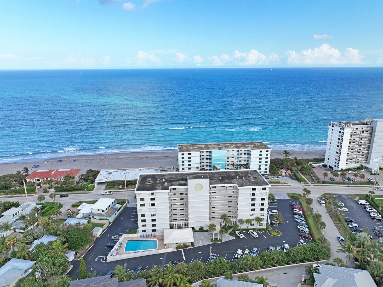 This gorgeous coastal retreat offers an unbeatable combination of luxury, space, and location in the heart of Juno Beach. With expansive ocean views, the open floorplan seamlessly blends modern coastal design with functionality. The custom kitchen is a true showstopper, featuring a massive island, sleek quartz countertops, and stainless steel appliances. Herringbone wood tile flooring flows effortlessly through every room, adding a touch of elegance. Custom closets and meticulously designed bathroom cabinets enhance both style and storage. The bathrooms offer high-end finishes, including frameless shower doors, for a spa-like experience. This property has great walk-ability to restaurants, shops, the Juno Beach Pier and much more! Milestone inspection was completed and passed!