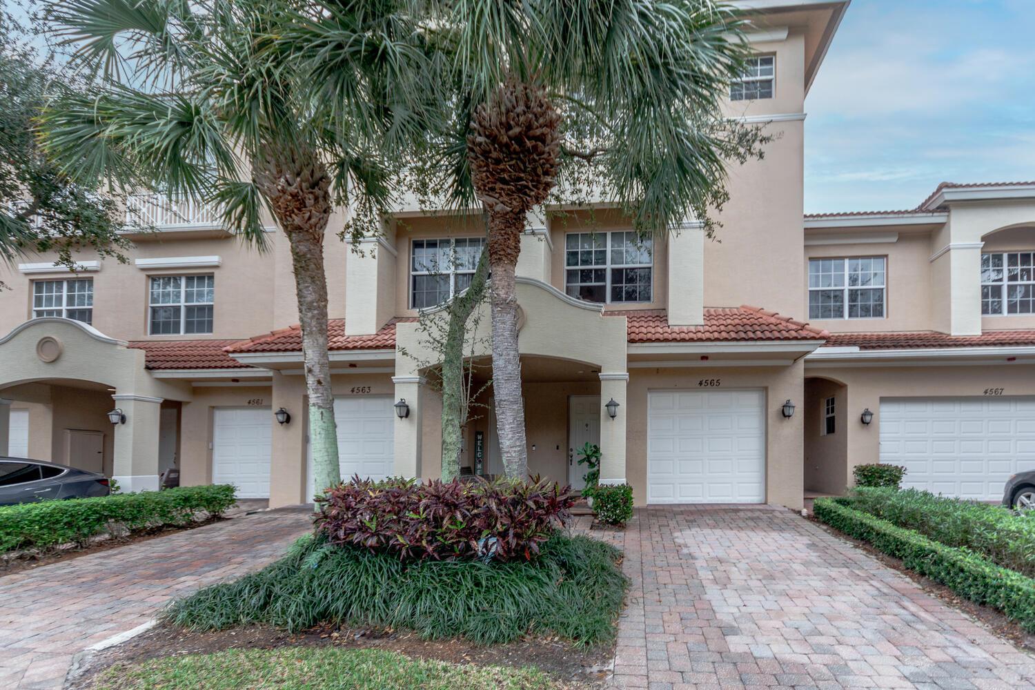 A must see! The waterfront property is located in the rear of the gated community and is walking distance to the shops at Donald Ross. The home was built with a 2-car tandem garage, hurricane impact windows, granite countertops, with tile and laminate flooring throughout each room. Two new white oak staircases were just installed with engineered white oak wood located on bottom floor. The walk-in closets make for easy organization and the separate living of each room makes for privacy. The beautiful townhome is equipped with an upgraded W/D, stainless steel appliances, and a 2023 A/C unit. The tray ceiling in the master bedroom truly brings out the room and you can relax in your beautiful Jacuzzi tub after a hard long hard day. Please don't miss out on this beautiful townhome!