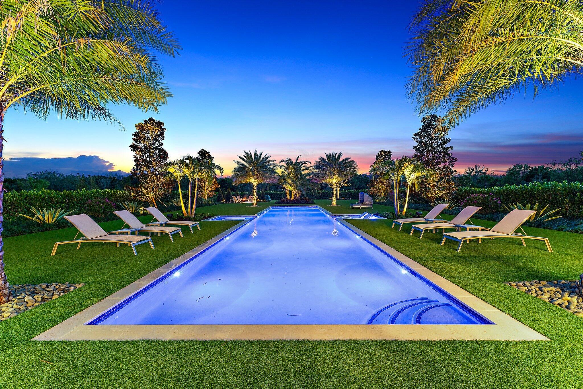 Looking for a one-acre estate home with amazing features and outdoor spaces? This is it. Huge oaks and royal palms circle the front motor court, and the entire rear yard perimeter is lined with 7' clusia hedging for the ultimate in privacy. The view from the great room is across the 75' lap pool with 8' x 8' spa and mirror image sun shelf. Get away from it all at your custom fire pit with a forged metal cauldron which burns real firewood. The pool coping, patio deck, and fire pit areas are all poured concrete foundations, finished with a Capri Limestone deck. Electric screens offer easy access to the summer kitchen with Double Eagle BBQ, Sub-Zero ice maker and refrigerator, sink and trash. All turf in the rear year is artificial for perfect look and low maintenance. The patio deck was expanded, and the clear cypress was added to the ceiling. Indoor features include Wolf and Sub-Zero appliances, two Sub-Zero wine coolers, custom bar, great room built-in, and all closets. The Primary closet was tripled in size by combining with the home office. All windows in bedrooms have electric blinds, and one of the guest bedrooms was converted into a home office with built-ins and a Murphy bed for occasional guests. Decorator finishes abound - as seen with the custom light fixtures, furniture, art work and accessories - all which are less than one year old. All AV equipment, including all TVs and Sonos system is new too, and AC was added to the 3 car garage in March of 2024, and a new 26KW generator was added in July of 2024. The second floor includes a huge loft area, billiards table, large seating area, plus a bedroom with two closets and a full bath. This rare Layton floor plan is a must see. Come view the best of Bridgewater!
