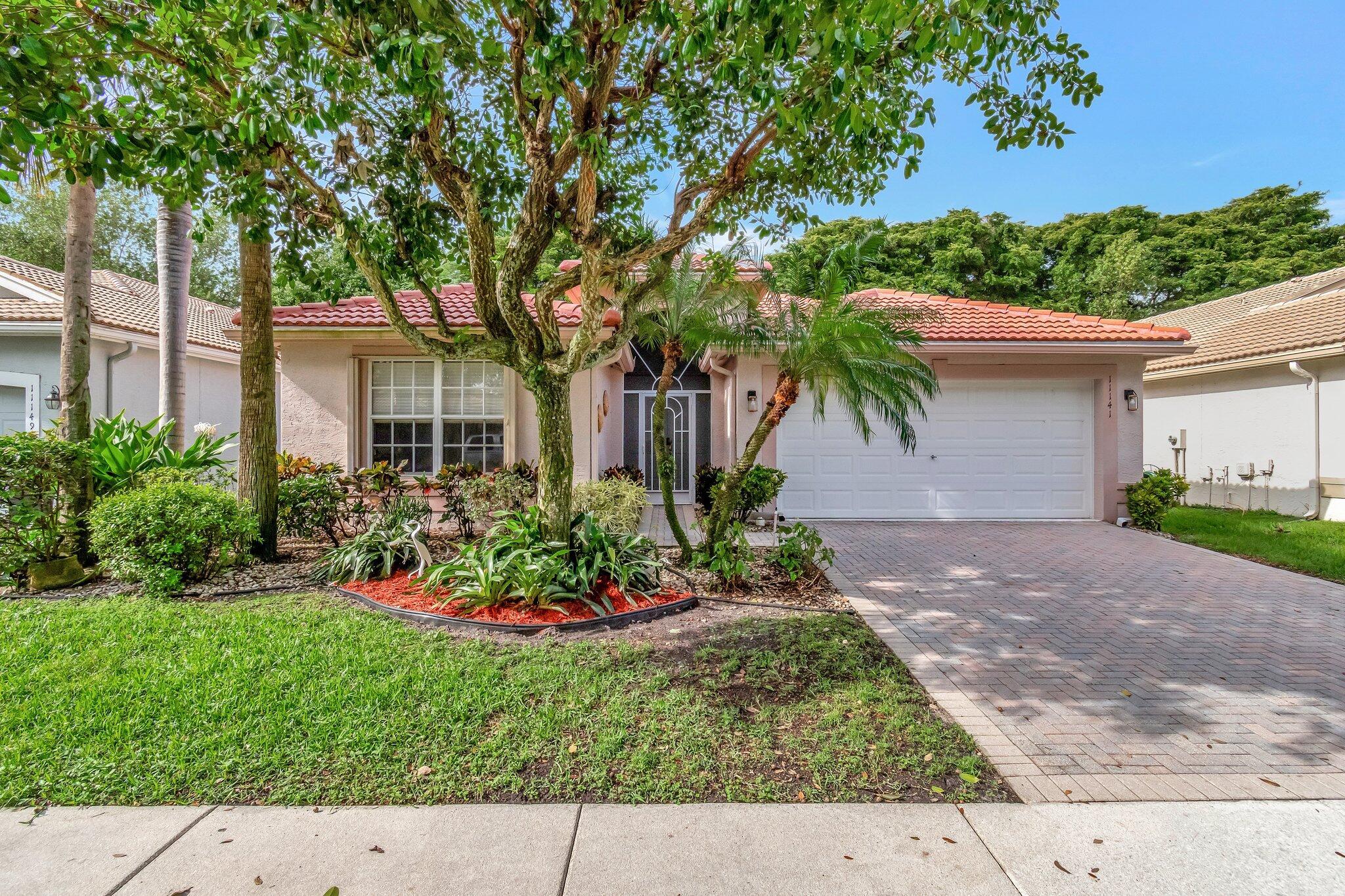 INCREDIBLE BUY!! LOWEST PRICE IN VALENCIA ISLES!!  Make this affordable gem yours before the Season heats up!!  NEW 2024 ROOF / 2019 AC / 2016 HWH / NEW BR CARPETING. FRESHLY PAINTED, MOVE-IN READY Coral Model !! Quick Close!  NEW SS APPLIANCES,  updated WHITE Kitchen. 2+/2 with Family Room, Living Room, Dining Room, Primary BR, Guest BR, den/office, screened lanai with private, shaded yard. Valencia Isles features stunning renovated Clubhouse, full-service Bistro, Sports Center, 3 pools and spa, tennis & pickleball courts, biking, walking paths, many clubs, Show series. Your piece of Paradise awaits !!