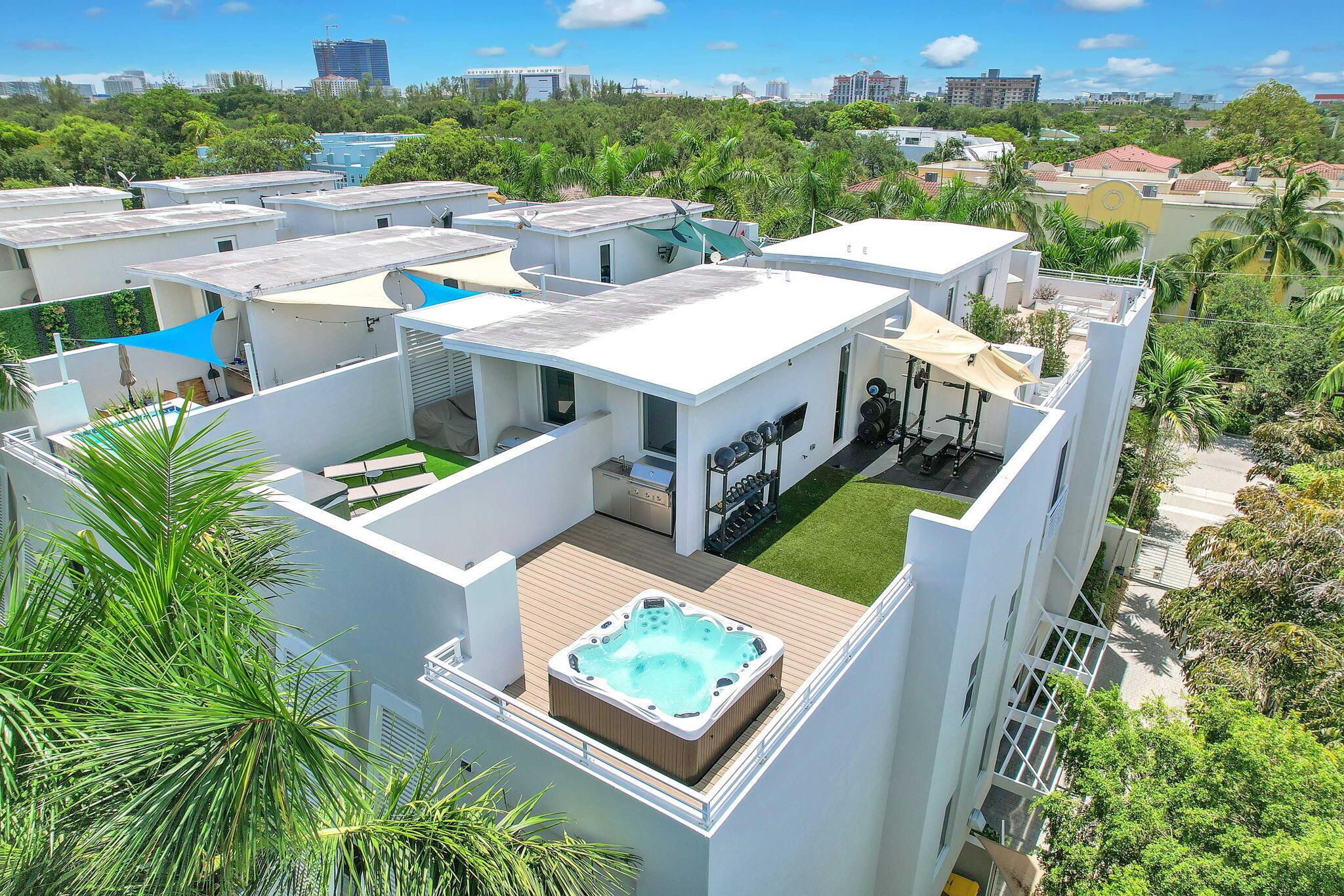 Live in luxury with this fully renovated four-level townhome located in downtown Fort Lauderdale. The only corner unit available holding 3 bedrooms and 3.5 bathrooms, this expansive home offers an open-concept layout perfect for modern living. The state-of-the-art kitchen is equipped with high-end appliances, ideal for any culinary enthusiast. Additional features include an elevator and integrated surround sound throughout the home. The rooftop terrace is a true entertainer's paradise, featuring a summer kitchen and a relaxing spa. Each bedroom comes with custom-built closets for optimal storage. Combining sleek design with functional living, this exceptional property is sure to impress.Schedule showings, call/sms.