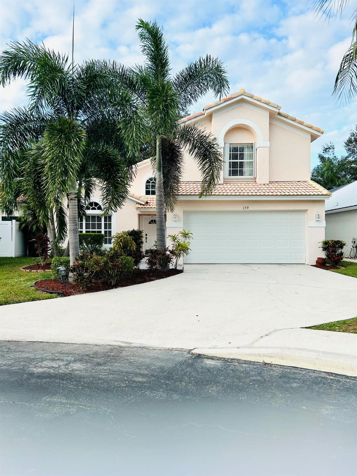 Welcome to 159 Spoonbill Court located in Egret Cove at Maplewood in Jupiter. This elegant home has been beautifully maintained. The kitchen has been partially upgraded with marble styled quartz countertops and new lower kitchen cabinets. Downstairs half bath and upstairs guest bath have also been partially upgraded. The new Spanish barrel tile roof was completed in 2023 and in the living areas new elegant marble style porcelain floors were installed. Freshly painted inside, this home has natural light throughout thanks to its prime cul-de-sac location, creating an inviting atmosphere. Have coffee out in the spacious patio which was recently professionally finished with high quality artificial turf and pavers. Close to highly rated schools, 10 min from I95, Turnpike and the BEACH! Welcome