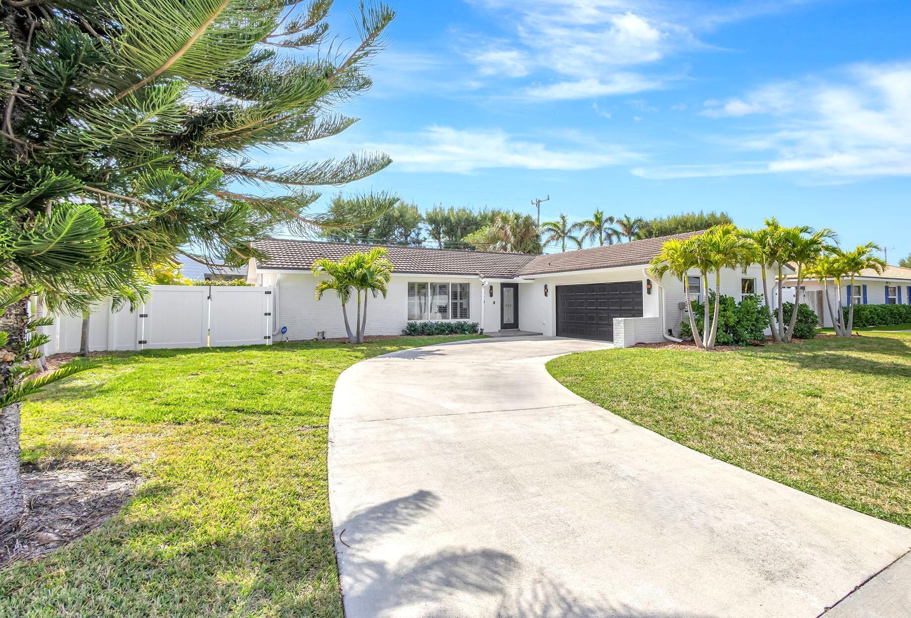 Be the first to enjoy the brand new heated pool of this beautifully renovated 3 bedroom, 2 bath home in Yacht Harbor Estates.  Features include large open living / gourmet kitchen areas, a custom island with unique, quality countertops, gold accents, and new flooring throughout.   Custom features continue into the remodeled bathrooms with modern ramp sinks with slot drains, a toilet / bidet with many functions, and other quality fixtures. The backyard is a south facing, private, fenced retreat that along with the new heated pool, has a gazebo, covered patio,  lots of open area, landscaping, and wraps around to the ample sized side yards.   Close to PBI airport and just a short walk to the beach, Singer Island amenities, and hotels.