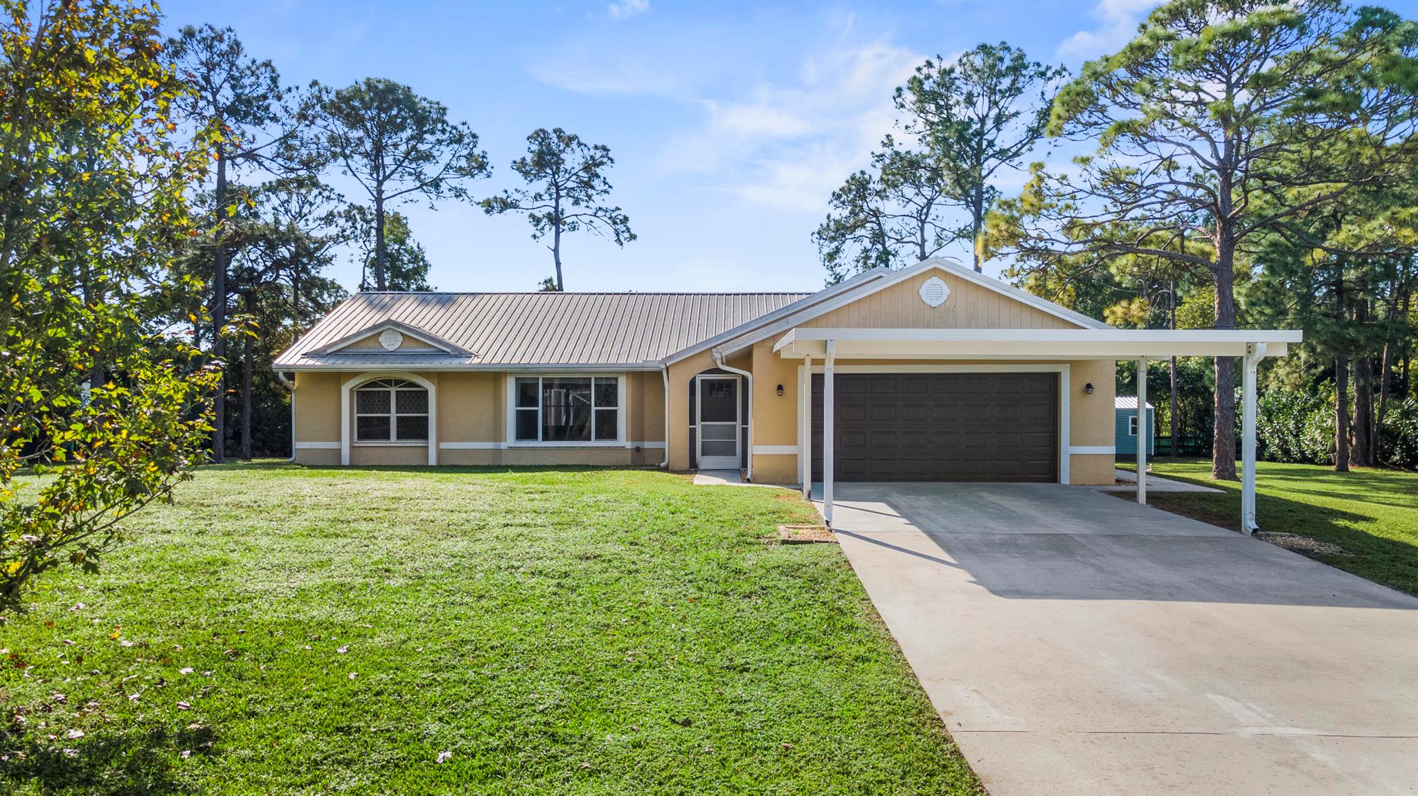 Experience the Best of Country Living in Loxahatchee!Discover the perfect blend of tranquility and modern convenience in this beautifully upgraded 3-bedroom, 2-bathroom home, set on an expansive 1.25-acre fully fenced lot with an electric gate for privacy and security. Designed for both comfort and functionality, this property offers covered parking, a spacious 2-car garage, and even a full RV hookup.Inside, the open floor plan welcomes you with vaulted ceilings and a seamless flow. The chef's kitchen is a showstopper, featuring custom wood cabinets, elegant granite countertops, and premium stainless steel appliances, including a cooktop and wall oven. An extended waterfall countertop doubles as a casual dining space--just add your favorite barstools! The entertainment-ready living room is prepped for movie nights, complete with a full stereo setup and large TV support.
The master suite is your private retreat, boasting a custom walk-in closet and a spa-like en-suite bathroom. Pamper yourself in the oversized step-in shower with dual rain showerheads, wall jets, and digital temperature controls. The additional bathrooms are equally impressive, fully updated with sleek modern finishes.
Step outside through French doors into a screened-in patio and pool area designed for year-round enjoyment. The saltwater pool, heated by solar panels, offers an eco-friendly and cost-efficient solution. The backyard is an entertainer's dream, featuring a grilling area, a cozy firepit, and ample space for gatherings. A large storage shed adds even more convenience.
Additional highlights include a durable metal roof (installed in 2013) and countless thoughtful upgrades throughout.
This property truly offers the serenity of country living paired with modern luxuries. Don't miss your chance&#x14;schedule your private showing today and make this exceptional home your own!