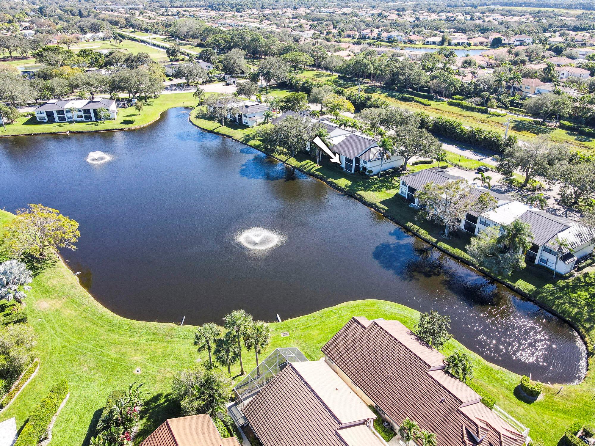 Fantastic opportunity in this first floor condo in Eastpointe. Spectacular lake views welcome you the moment you walk in to this beautifully updated home. Great open kitchen with granite counters and added wall of cabinets with microwave and wine cooler all open to the living room and dining room and beyond to the screened lanai.  The Primary has a large bath w/double  vanity, shower, water closet as well as a walk-in closet and additional double closet.  The guest room has its own bath with a laundry closet adjacent.  There is so much to do in Eastpointe with its 2 golf courses, pickle ball, tennis and a whole host of social activities.  Just 10 minutes to the beach, 15 to the airport and an abundance of restaurants very close by.