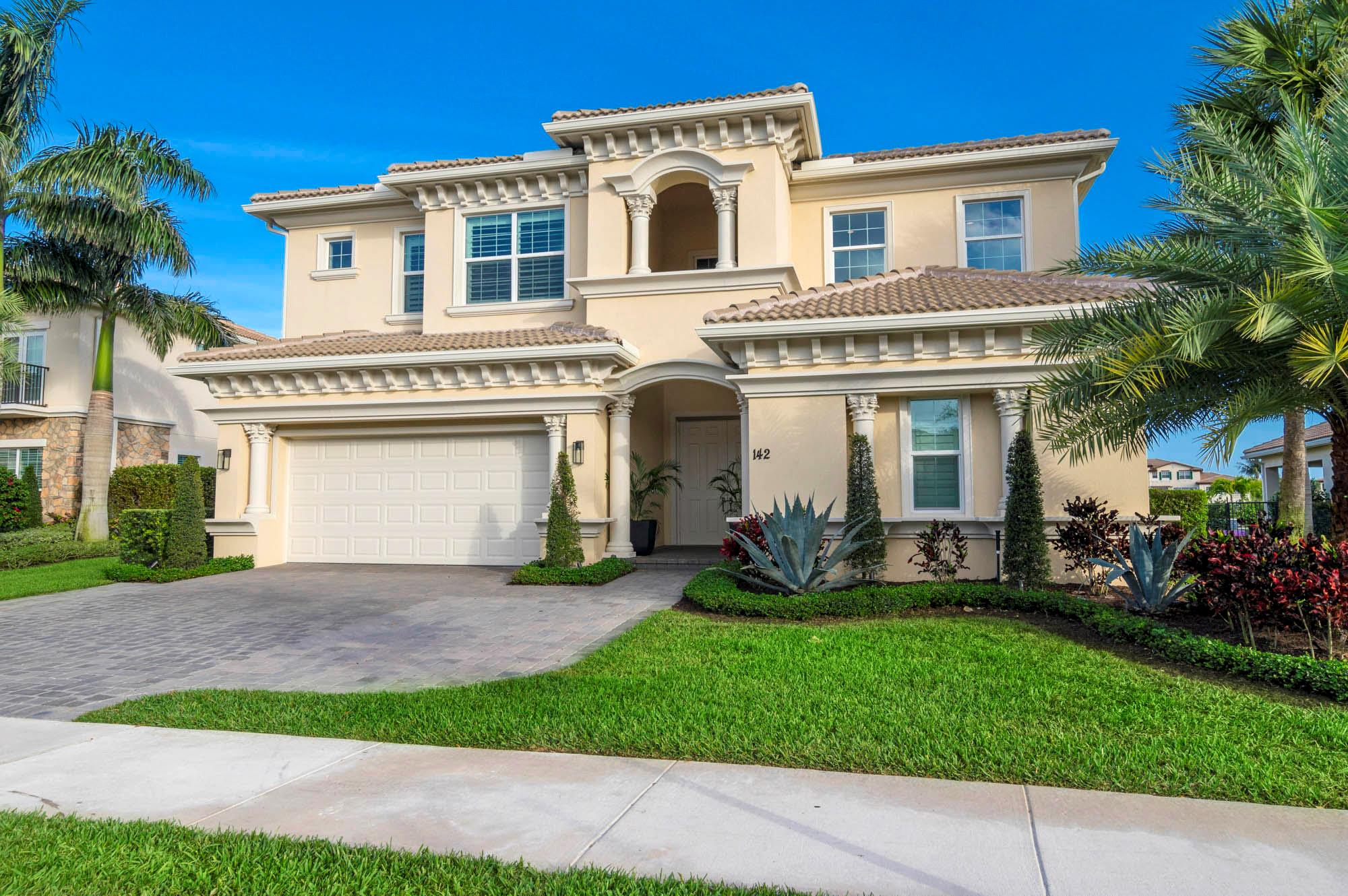 Luxuriously appointed, this coveted extended Santangelo model has been renovated with absolutely stunning finishes. BONUS: ASSOCIATE GOLF MEMBERSHIP is available to the buyer of this home or it can be downgraded to a social membership. Located in the resort-style gated community of Jupiter Country Club, this spacious floor plan offers 4 bedrooms, a flex room/office (or 5th bedroom), 3 1/2 baths, plus a loft. Step out from the open concept great room into the outdoor oasis. Inviting & spacious, this area boasts an extended covered lanai, motorized retractable screens, a large outdoor fan, built-in speakers, a panoramic lake view and a lovely pool & flush spa surrounded by travertine pavers and lush tropical landscaping. Sunsets are enchanting from this relaxing outdoor living area! The upgraded double impact glass front doors welcome you into the home where hardwood flooring flows throughout. Stylish light fixtures &amp; ceiling fans were hand-selected for each area of the home. The gourmet kitchen is the heart of the home and features a mitered-edge expansive quartz center island, a stainless farmhouse sink, double wall ovens, solid wood white soft-close cabinetry, a 6 burner gas cooktop, a luxurious quartz backsplash &amp; sleek vent hood. The primary retreat is on the first floor along with one guest bedroom with en-suite bath, a powder room and a flex room which could also be a 5th bedroom. Upstairs is a large loft area with an additional flex space which could be used as another office; 2 bedrooms and a Jack &amp; Jill bath. The primary retreat is oversized with a sitting area, 2 spacious walk-in closets and a spa-like bath with dual vanities, a walk-in shower &amp; soaking tub. Jupiter Country Club is a luxury gated community conveniently located within close proximity of I-95 and the FL Turnpike, beaches, shopping, restaurants, parks &amp; nature preserves. Club amenities &amp; events offer a plethora of social opportunities and include a Greg Norman Signature golf course, 2 resort-style pools, the Sway restaurant &amp; bar, a state-of-the-art fitness center + yoga/mat pilates/barre group fitness classes, massage/facial treatment services, tennis, bocce ball, pickle ball &amp; basketball. Members enjoy reciprocal privileges to Invited Clubs worldwide. Live your best life here!