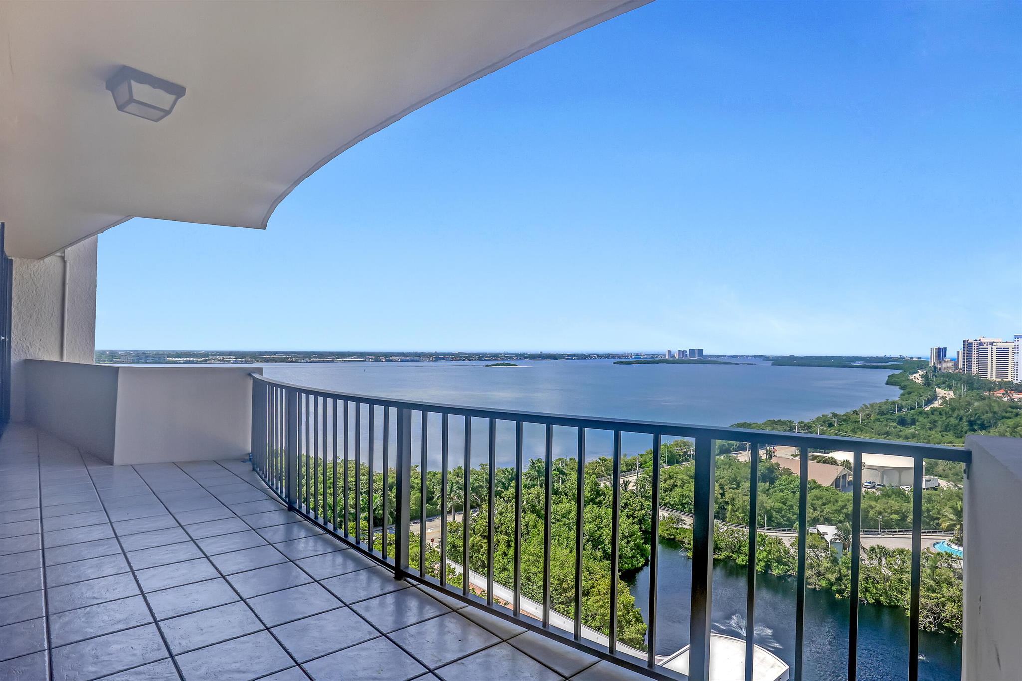 IMPACT WINDOWS COMING SOON!! - with lifetime guarantee and are fully transferable. Schedule for installation in coming weeks. (Wright's Impact Windows and Doors)  Enjoy a million-dollar view from the 16th story with unobstructed northern skyline vistas of Singer Island, along with expansive intercoastal and ocean view. This unit boasts a desirable split bedroom floorplan, covered parking, and a spacious laundry room. Cote D'Azur offers an array of amenities, including a large pool deck, fitness center, tennis courts, exclusive beach access, sauna, and secure gated entry. The coveted beachfront, featuring natural rock formations, provides year-round beach access and manned beach services 365 days a year. Perfect unit to custom design to your liking!!