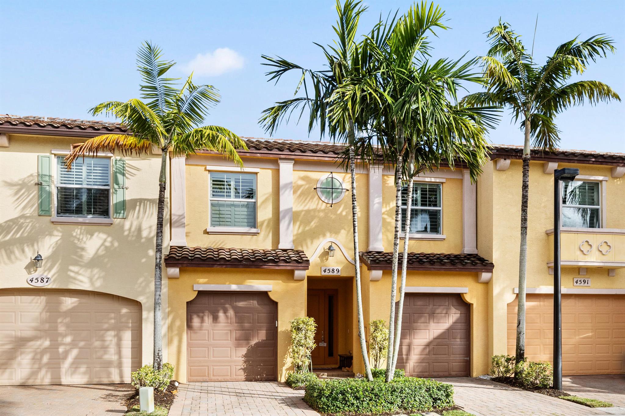 Imagine waking up each day to a peaceful lake and fountain right outside your window. This 3-bedroom, 2.5-bath townhome has been fully updated, from the brand-new floors to the sleek quartzite countertops in the kitchen. Downstairs, you'll find a fresh powder room and open living area that feels welcoming the second you step inside. Plantation shutters lend a classic touch throughout, giving you control over light and privacy in every room.Upstairs, the master bedroom offers plenty of space and a large walk-in closet, perfect for keeping everything organized. The master bathroom is your perfect oasis whether you want to soak in the tub or take a hot shower after a long day.There's also a ''his-and-her'' split garage, so you never have to worry about juggling cars.