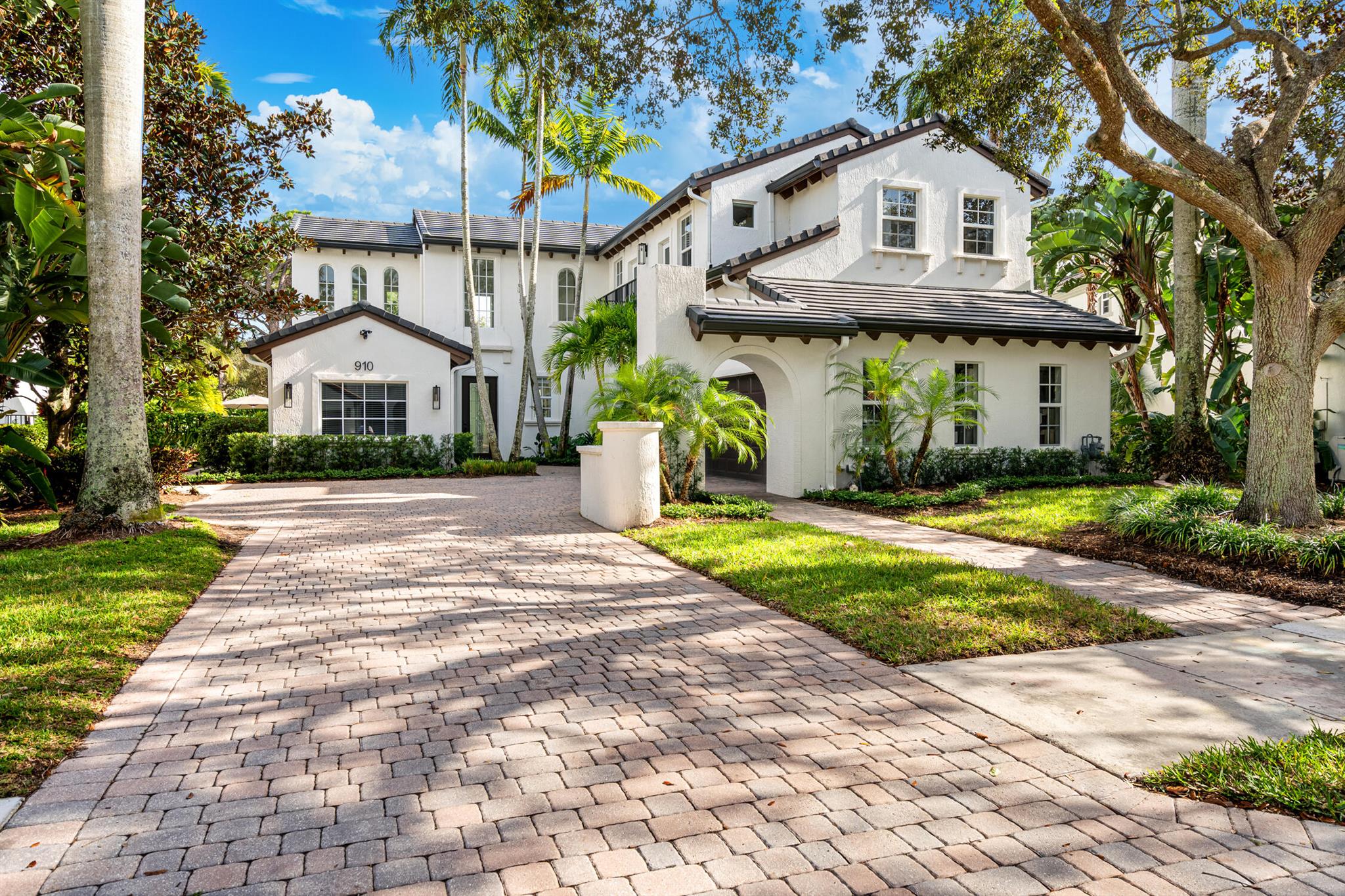 Welcome to 910 Mill Creek Drive, an exceptional residence nestled in the highly sought-after, centrally located Evergrene community of Palm Beach Gardens. Impeccably transformed by Palm Club Design Group, this home combines timeless elegance with contemporary luxury, offering the highest standard of living. The expansive open-concept design, with soaring ceilings and white oak floors, is bathed in natural light and complemented by a brand-new roof, impact windows, and cutting-edge upgrades. The chef's kitchen is a true highlight, featuring top-tier Fischer &amp; Paykel appliances, custom cabinetry, and stunning countertops. A bespoke office with custom cabinetry provides the perfect space for both work and relaxation. The home is further enhanced by a new A/C system with advanced UV Light / Halo Purification technology, ensuring optimal comfort and air quality. The luxurious master suite serves as a private retreat, complete with a spa-inspired bathroom and custom walk-in closets.

Outside, the newly designed outdoor space is an entertainer's dream, offering a resort-style pool, expansive covered patio, and serene privacy. As a resident of Evergrene, enjoy unparalleled amenities such as a private clubhouse, fitness center, walking trails, and 24/7 guard-gated security. Ideally located, this home is just minutes from pristine beaches, fine dining, world-class shopping, golf courses, and convenient access to Palm Beach International Airport and the Brightline station.

With its flawless renovation, high-end finishes, and prime location, 910 Mill Creek Drive represents an unmatched opportunity to experience luxurious living in Palm Beach Gardens.