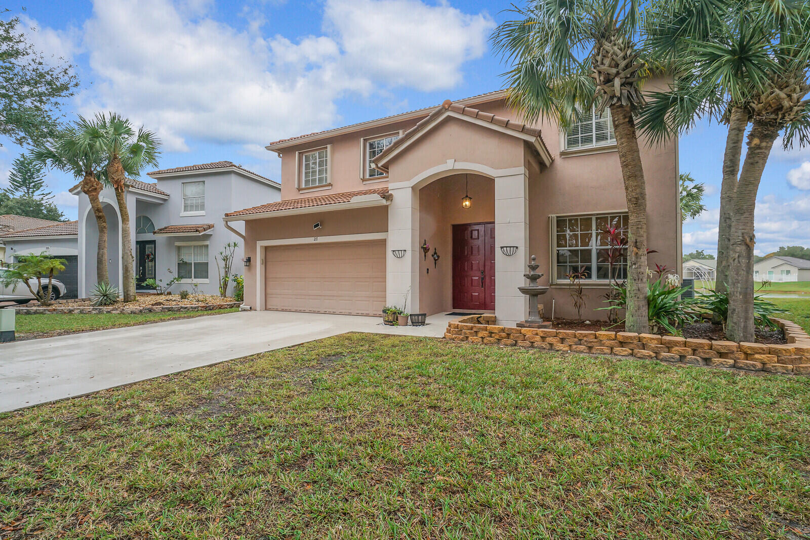 Welcome home to this charming Mediterranean-style, multi-level single-family home nestled in the desirable Seminole Estates neighborhood of Royal Palm Beach. This spacious home, built in 2002, offers 2,565 square feet of living space, featuring four bedrooms and two and a half bathrooms. The interior boasts a welcoming foyer, a pantry for ample storage, volume ceilings that enhance the open feel, and walk-in closets providing generous space. The well-appointed kitchen includes stainless steel appliances, lots of cabinets for storage, and a breakfast nook. Situated on a oversized waterfront lot, the property offers a comfortable outdoor area for relaxation or entertainment. Large screened patio area! Low HOA fees and great amenities for all residents to enjoy! Great schools and shopping!