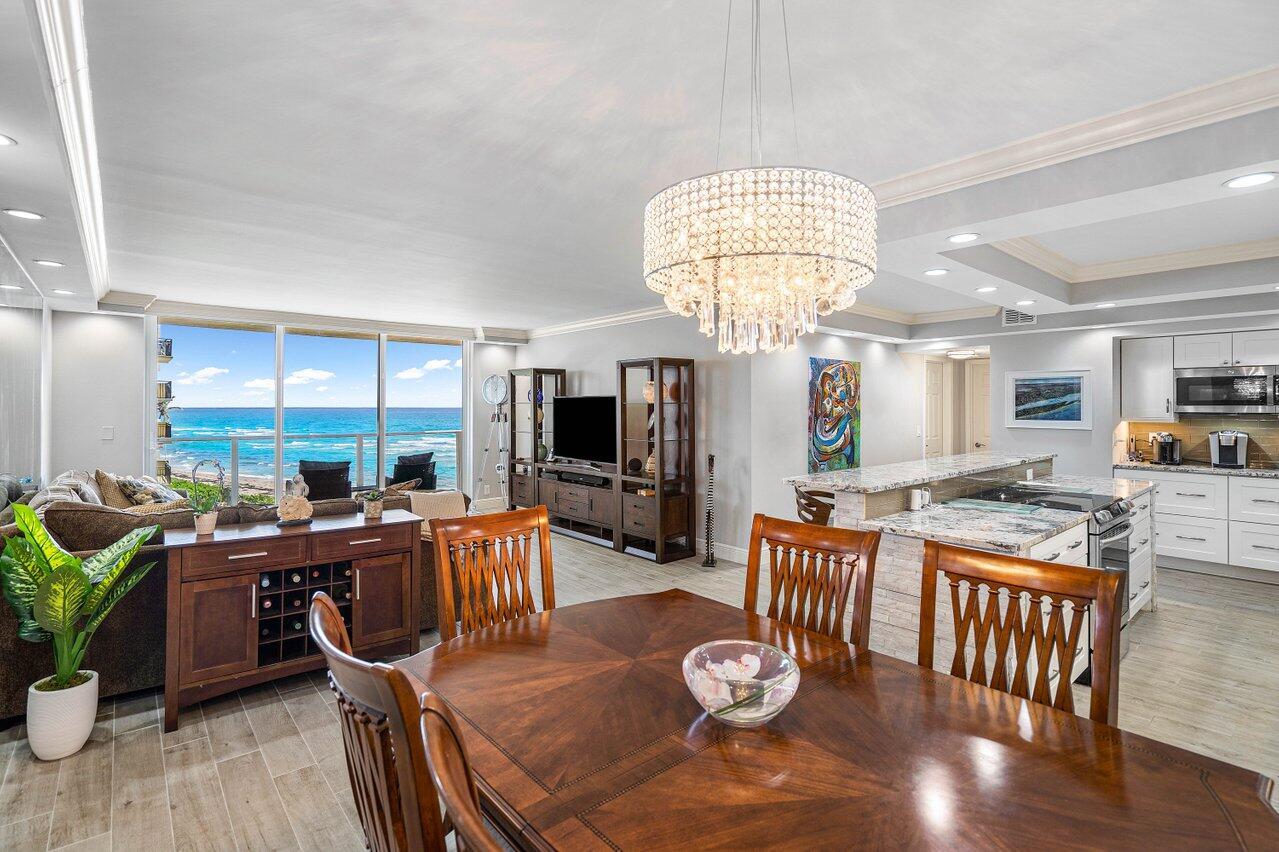 Best value on Singer Island!!! Welcome to your renovated oasis on Singer Island, where every  detail has been considered. This oceanside condo offers breathtaking ocean and Intracoastal views. The 2-bedroom, 2-bath unit has been beautifully remodeled, featuring a chef's kitchen with brand new appliances, including a convection range with a built in air fryer, sleek countertops, and soft-close cabinets. The open space is perfect for entertaining, complemented by beautiful porcelain floors throughout. Rare in-unit washer and dryer, and Floor-to-ceiling slider doors with hurricane impact windows, leading to your glass balcony. The master bedroom boasts a custom walk-in closet and offers a stunning, unobstructed ocean view, allowing you to wake up to the serene sight of the waves each morning
