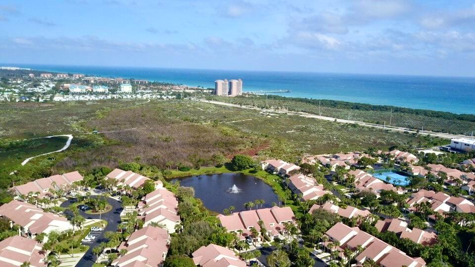 Spectacular unit with overlooking gorgeous lake views along with natural dunes. Escape to Paradise with minutes from the pristine beach and shops and restaurants all within walking distance. Unit is easily the most sought after in the whole of sea oats especially with the views. The community offers out of the world Clubhouse along with state of the art pool and tennis facilities. Best location in all of Jupiter/Juno beach