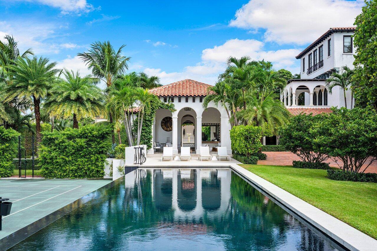 Lavish Living at the 12 Lagomar Estate! Landmarked Mizner residence on a spacious double lot. Indulge in the luxurious pool house featuring a full kitchen and bar, alongside a 100 ft exquisite pool. Enjoy the scenic views from the first and second floor loggias. This opulent property boasts 5 bedrooms, a private tennis court, and an expansive gated entry. Elevate your experience with the convenience of an elevator and a 2-Car garage. Experience the magnificence of the intracoastal from the primary suite, complemented by dual bathrooms. Unwind with easy, deeded access to the beach, completing this unparalleled rental opportunity.