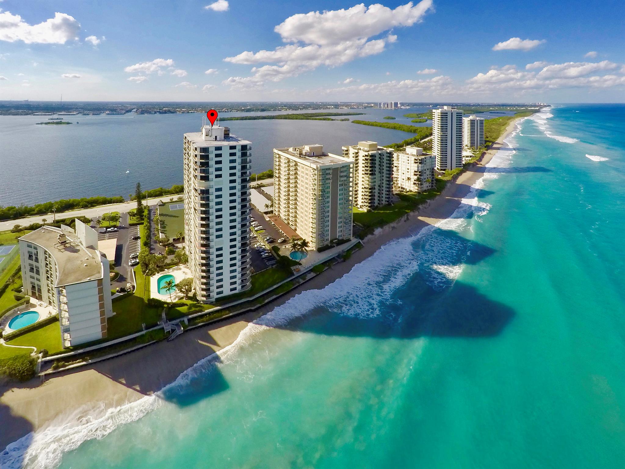 Wow!! This is what you will say when you walk into this 2 bedroom/2bath furnished condominium. The high expansive view is truly a sight to see. You can see all the way down the coast to Palm Beach and the West Palm Beach skyline. The unit has a great split plan with two large bedrooms both with access to the covered balcony and gorgeous ocean views. The kitchen has been redone with white cabinets, Corian counter tops and white appliances. The dining area is spacious with an expanding table to accommodate large gatherings. The living room has fantastic views and is comfortably appointed for nights in. Connemara is a lovely building with great amenities including beach access, pool, fitness room, extra storage, community room, on-site management, garage parking and more.