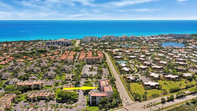Experience the Best of Jupiter's Coastal Lifestyle!  Enjoy this spacious 3-bedroom, 3-bathroom condo, just a short stroll from beautiful Jupiter Beach. This inviting home features updated kitchen and bathrooms, elegant tile flooring, and full-size washer and dryer. Step onto the large screened balcony, perfect for entertaining or unwinding with serene coastal breezes. Located in a secure building with a lobby and  elevator, this condo offers both comfort and convenience.  Building underwent complete concrete restoration in 2022.  Community offers multiple pools, assigned parking, roaming security and on site manager. Tennis courts are available with membership. Appreciate easy access to Jupiter's best attractions, including boutique shopping, top-rated restaurants, the scenic Riverwalk, Jonathan Dickinson State Park, Juno Beach Pier, public golf courses, boating, fishing, and The Maltz Theatre and a quick drive to Palm Beach International Airport. Your coastal dream condo is waiting! Schedule a private showing today and make this slice of Jupiter your own!