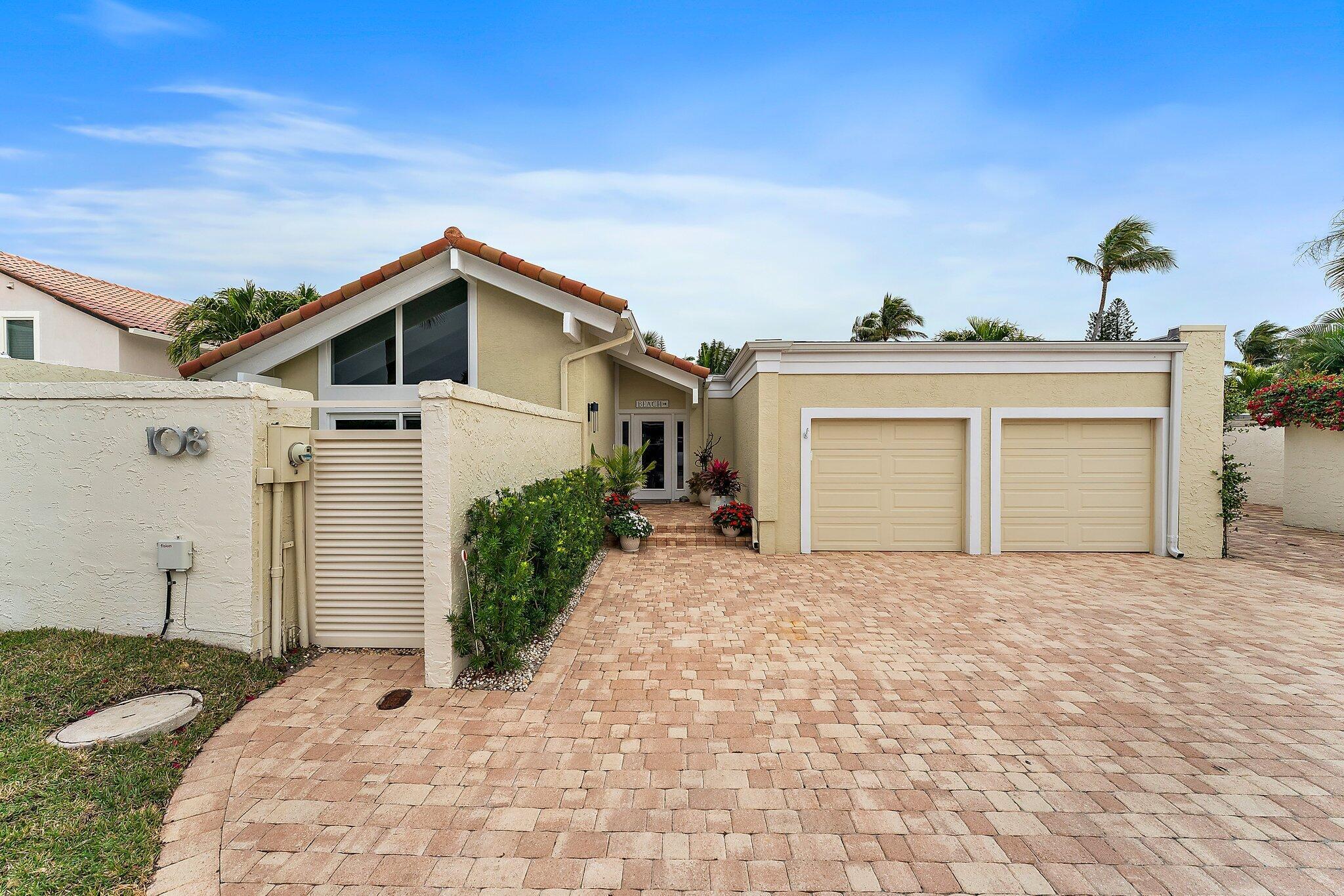 Spectacular and completely renovated 3 BR/2 BA one-story pool home steps to the beach. Impact windows and garage doors, stucco + cement plank siding, driveway pavers, heated saltwater pool with new finish, updated landscaping and exterior lighting. Porcelain wood-grain tile throughout the house. Expanded kitchen with stainless steel appliances, Nolte cabinets, quartz countertops plus top-of-the-line fixtures. Remodeled bathroom layouts with Nolte cabinets, quartz countertops, designer lighting, frameless shower enclosures. Private master outdoor shower area. This is a must see! Shows like a model!