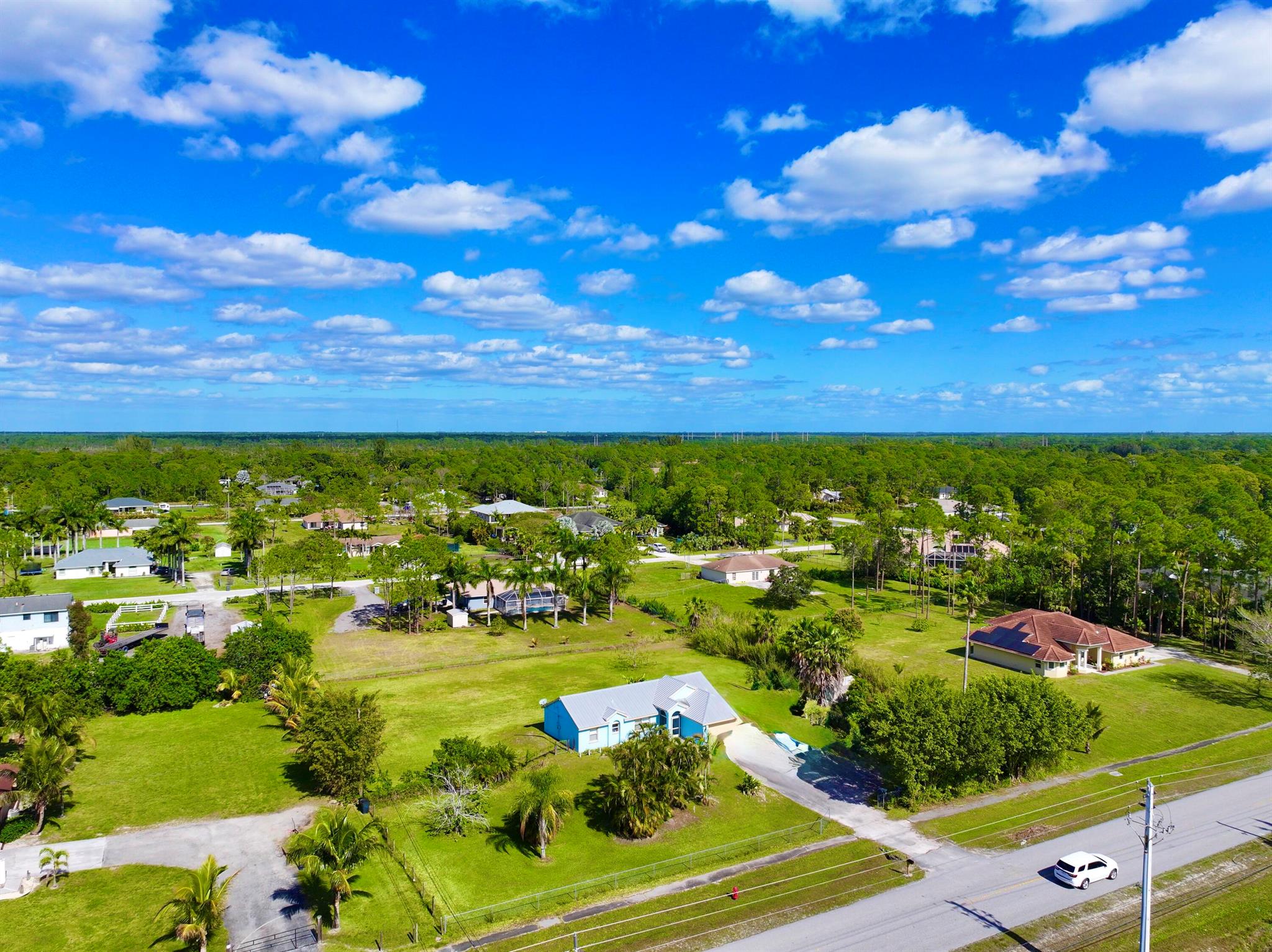 * PRICED RIGHT * !!!! LOOK  !!!!  PAVED ROAD **CITY WATER *** GENERATOR TRANSFER SWITCH ****  STUNNING 1.19 ACRES ESTATE IN LOXAHATCHEE , FLORIDA 33470 ***NESTLED IN THE SERENE HEART OF LOXAHATCHEE,  THIS BREATHTAKING 1 PLUS ACRE PROPERTY OFFERS THE PERFECT BLEND OF MODERN COMFORT AND COUNTRY CHARM **. THIS EXPANSIVE  LOT PROVIDES AMPLE SPACE FOR PRIVACY, RECREATION OR EVEN FUTURE DEVELOPMENT , MAKING IT IDEAL FOR FAMILIES, EQUESTRIANS, OR THOSE SEEKING A PEACEFUL RETREAT JUST MINUTES FROM MAJOR AMENITIES AND HIGHWAYS **. THIS METICULOUSLY MAINTAINED 4 BEDROOM , 2 BATHROOM HOME  FEATURES AN OPEN-CONCEPT FLOOR PLAN THAT INVITES NATURAL LIGHT THROUGHOUT. THE CHEF-INSPIRED KITCHEN BOASTS STAINLESS STEEL APPLIANCES, CUSTOM CABINETRY, AND ISLAND/ BREAKFAST AREA PERFECT FOR FAMILY GATHERINGS * THE SPACIOUS LIVING/ FAMILY  AND DINING AREAS PROVIDE AN IDEAL SETTING FOR ENTERTAINING, AND OFFERS A WARM AND INVITING ATMOSPHERE **. THE MASTER SUITE IS A TRUE SANCTUARY, FEATURING A WALK-IN CLOSET AND A LUXURIOUS  EN-SUITE BATHROOM WITH A LARGE SHOWER AND DUAL VANITIES **. SECONDARY BEDROOMS ARE GENEROUSLY SIZED, OFFERING PLENTY OF ROOM FOR FAMILY AND GUESTS ** !!!!!  OUTSIDE, THE PROPERTY IS TRULY A MASTERPIECE.  THE LARGE BACKYARD IS PERFECT FOR OUTDOOR LIVING **. PLENTY OF SPACE FOR A POOL, AND ROOM TO PARK THE RV, BOAT , TRAILER  ***   WITH 1.19 ACRES  THE POSSIBILITIES ARE ENDLESS- BUILD A BARN FOR HORSES, CREATE A LUSH GARDEN, OR SIMPLY ENJOY THE TRANQUILITY OF THE EXPANSIVE LANDSCAPE ***. !!!!!! LOCATED IN A PEACEFUL, RURAL SETTING BUT JUST A SHORT DRIVE FROM SHOPPING, DINING, SCHOOLS, AND MAJOR HIGHWAYS, THIS HOME OFFERS THE PERFECT BALANCE OF PRIVACY AND CONVENIENCE .   THIS INCREDIBLE PROPERTY AWAITS- SCHEDULE A SHOWING TODAY AND EXPERIENCE THE JOY OF LOXAHATCHEE LIVING ***.