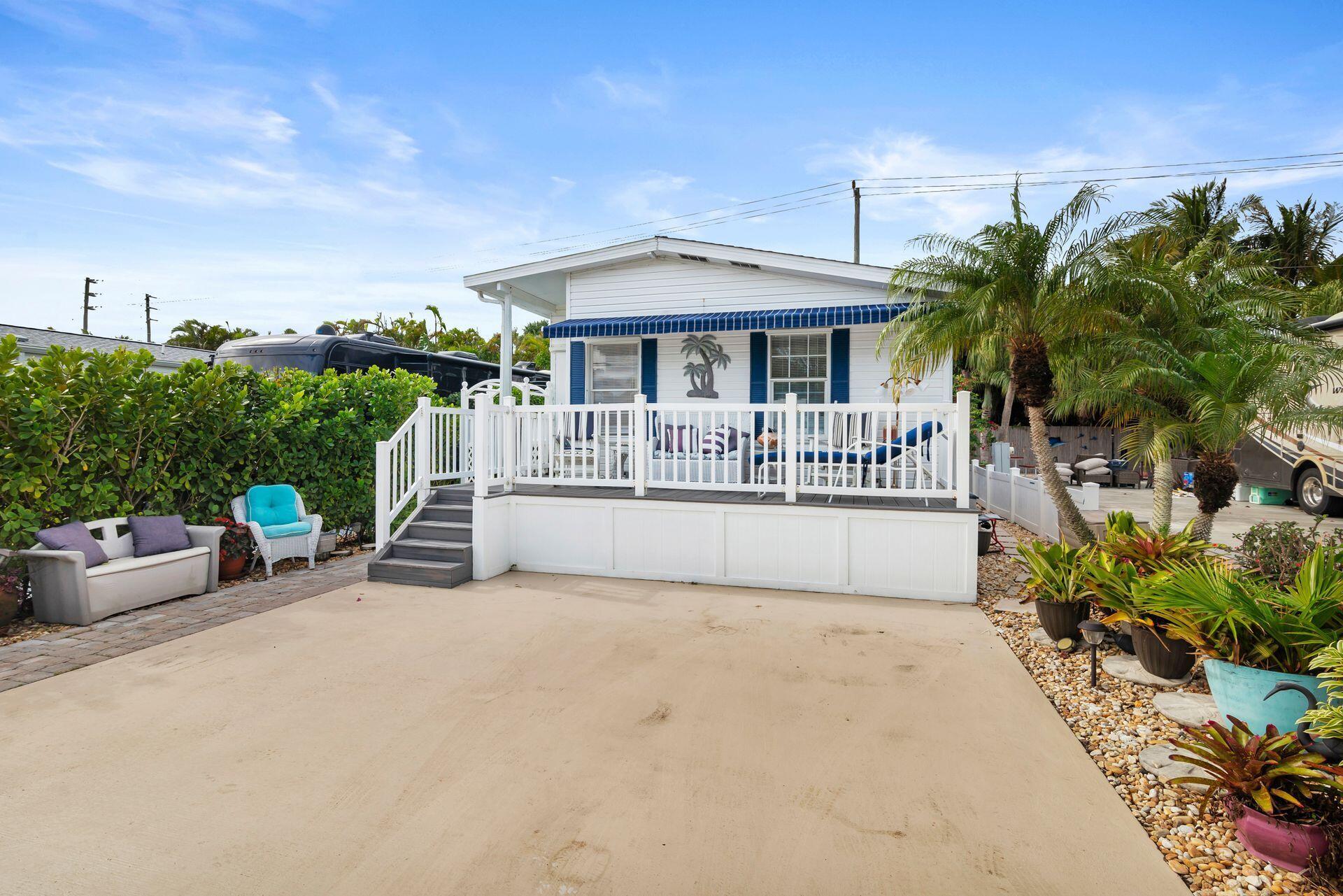 Welcome to Juno Ocean Walk RV Resort located steps from Juno beach and fishing pier. This lovely 1 bed/1bath unit has a south facing porch, an updated kitchen with lots of storage, expansive living spaces that are  light and bright and a private patio in the back, ready for entertaining. In unit washer/dryer, stainless appliances, and laminate flooring all add to the ambiance of beach living.Juno Ocean Walk RV Resort offers many amenities including a club house, heated pool, hot tub, billiards, pickle ball, exercise room, laundry facilities, dog walk, volleyball and many social activities offered seasonally. The lot can accommodate 2 cars. The community allows immediate rentals, no HOPA. Enjoy the ocean breezes, walk to the beach or partake of the amenities at this amazing resort