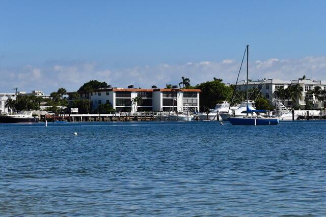 Location! A waterfront building with 2 Bedroom 2 Bath condo with an outdoor lanai, W/D in the unit, assigned parking and perfectly situated on the intercoastal. Enjoy sunsets, fishing, snorkeling and boat watching on the private dock.  Complex has a community pool and BBQ.  This is a hidden gem located in Palm Beach Shores across the waterway from Peanut Island. This condo is within walking distance of waterfront restaurants and beautiful beaches.   Right next door you will find the #1 voted best diving beach in America.