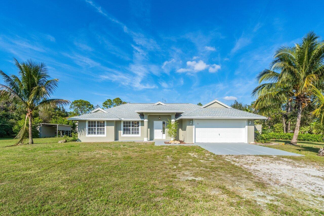 Beautiful 3-bedroom, 2-bathroom CBS home on over 1 acre! This home features a brand-new roof, a stunning new kitchen with white cabinets, granite countertops, and stainless steel appliances. Enjoy luxurious new flooring throughout and updated bathrooms with modern vanities, tiles, and fixtures. The AC was replaced in 2018, and a brand-new water heater has been installed. Move-in ready with stylish upgrades--don't miss this opportunity!