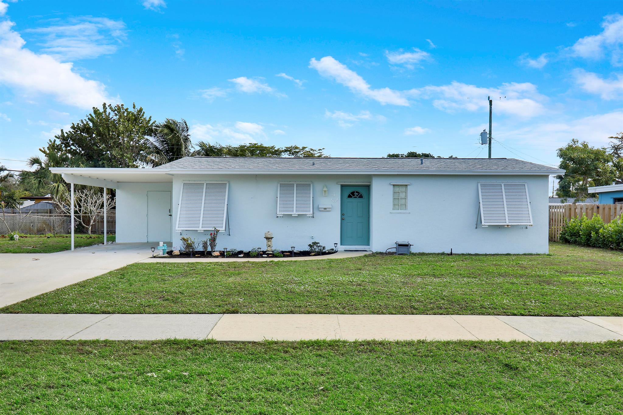 Newly offered updated 3/2 plus den/flex space with expanded driveway in the highly sought after Village of North Palm Beach. NO HOA in this golf cart friendly community! Roof, AC, and water heater are 2023. Renovated bathrooms and a new kitchen. Screened patio overlooks the fully fenced backyard with room for a pool. Conveniently located near beaches, schools, and stores. Only 12 miles to Palm Beach International Airport.