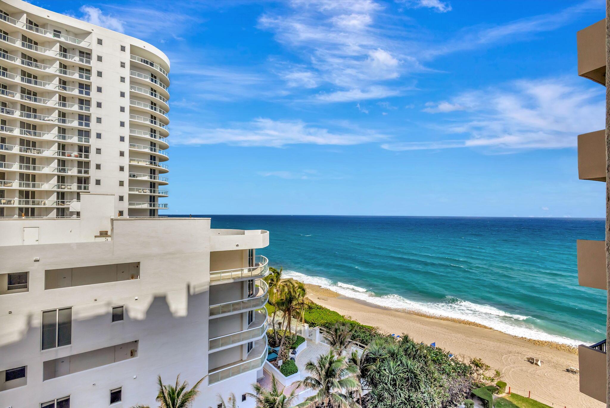 Recently renovated with exquisite attention to detail, this stunning northwest corner unit offers breathtaking views of both the Intracoastal and the ocean. The expanded modern kitchen features top-of-the-line KitchenAid appliances, an induction range, and a convection microwave, all contributing to its sleek, contemporary design. Elegant floated bamboo flooring flows throughout the living spaces, adding both warmth and style. The expansive primary suite includes a luxurious bath and a unique ocean view, framed by decorative adjustable interior shutters opening up to stunning ocean views. Additional features include a commercial-grade water heater and additional freezer.  Building amenities include a pool, fitness room, sauna, tennis courts, covered pavilion, and secured entry