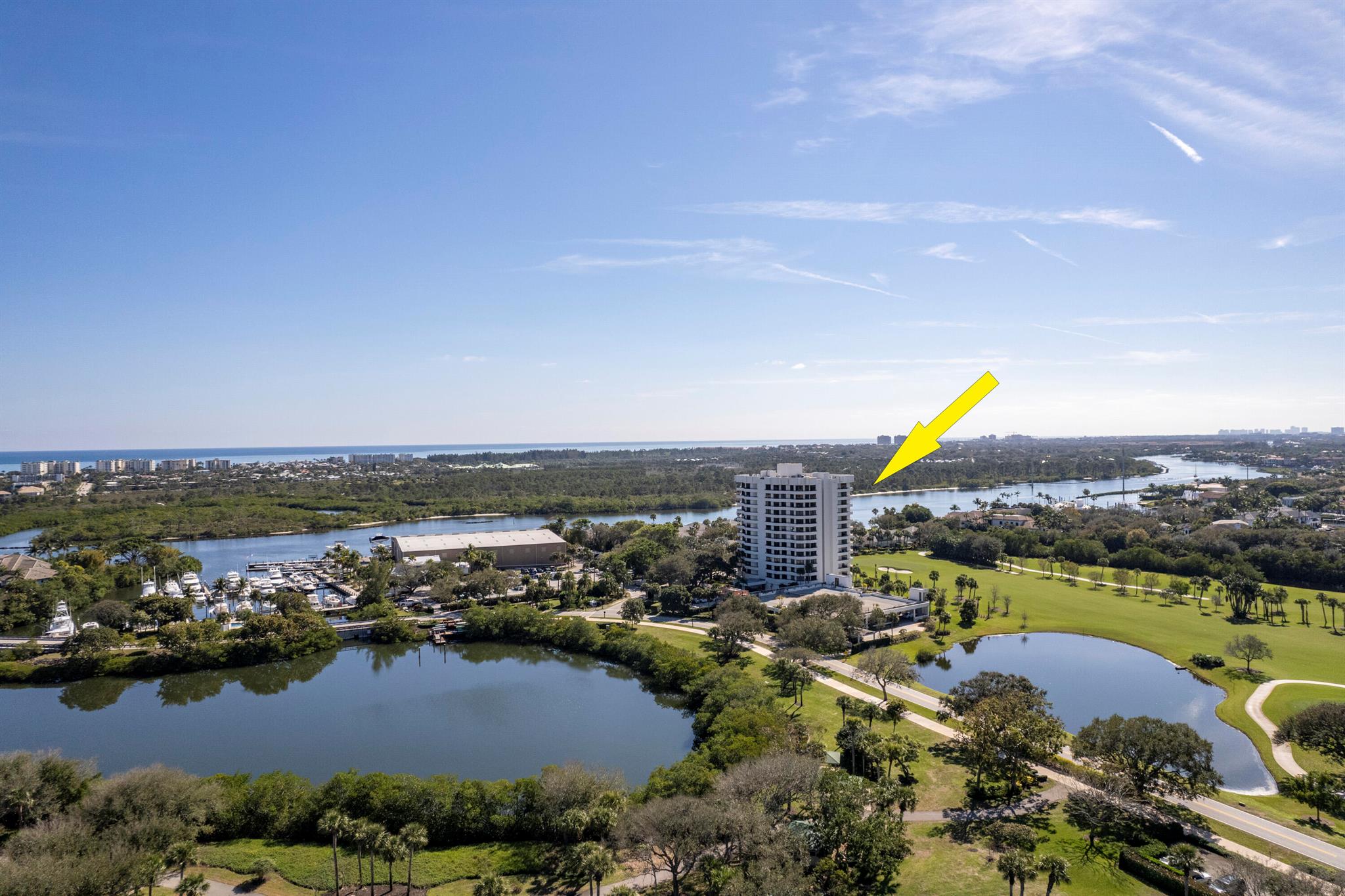 Enter thru beautiful wood double doors to an unparalleled lifestyle in the heart of Jonathan's Landing, one of Jupiter's premier private club communities.  This spacious, RARE 3 BR, 3 BA, light-filled high-rise condo offers breathtaking Intracoastal & golf course views, creating a serene & picturesque backdrop for everyday living.  Beautifully maintained.Property Features include: expansive wraparound balconies to enjoy stunning sunrises and sunsets;  open-concept living & dining areas bathed in natural light, perfect for entertaining;  Upgraded kitchen w/ granite countertops, custom cabinetry, & stainless steel appliances;  luxurious primary suite w/ panoramic views, ample closet space, and an en-suite bath; separate, dedicated storage room.   (continued) Resort-style amenities including golf courses, tennis courts, a marina, multiple dining venues, bocci, and more.  Situated just minutes from Jupiter's pristine beaches, world-class dining, and premier shopping, this exclusive residence combines privacy, security, and luxury with the convenience of a vibrant community. 

Experience elevated coastal living in this exceptional Jonathan's Landing high-rise&#x14;a rare opportunity in one of Jupiter's most sought-after locations.