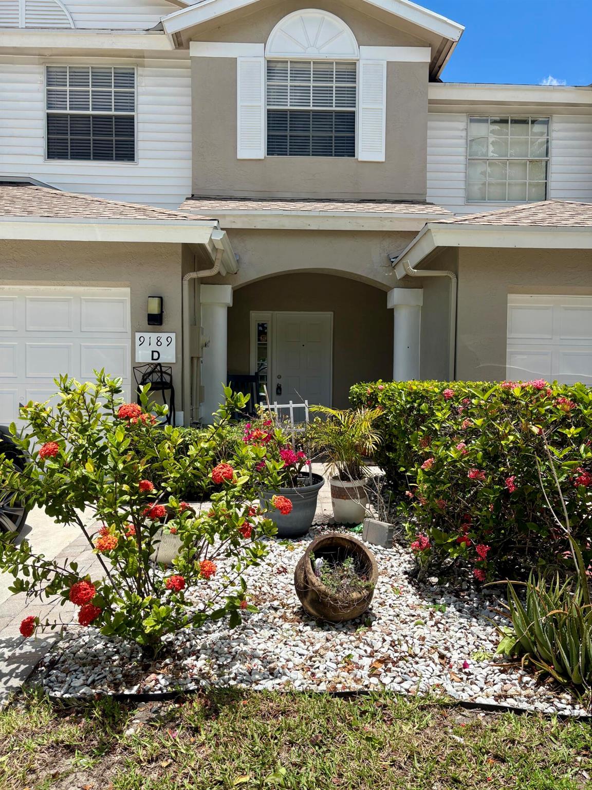 BEST VALUE in sought after Boca Gardens community. VACANT,PAINTED and waiting for you! This bright,airy spacious lake view townhome hosts 10 Ft. ceilings, 3 BR, 2 1/2 BA and 2000+sqft of living space. Enclosed patio can convert to den, florida room or office. Outdoor lake view patio for lounging. NEW ROOF 2024,and AC 2022, for years of peace of mind. Contemporary vinyl flooring on main floor, hardwood finish on second. Updated fixtures in all baths. Original, clean and functional kitchen ready for your personal touch. Split bedrooms, laundry on second floor. Large Master with walk in closet and split bath/shower. Pet friendly, close to A&B rated schools. Amenities:Clubhouse, gym, 3 pools, tennis, pickle ball, bike trails, basketball and playground. Schedule to view today! Ready to SELL!