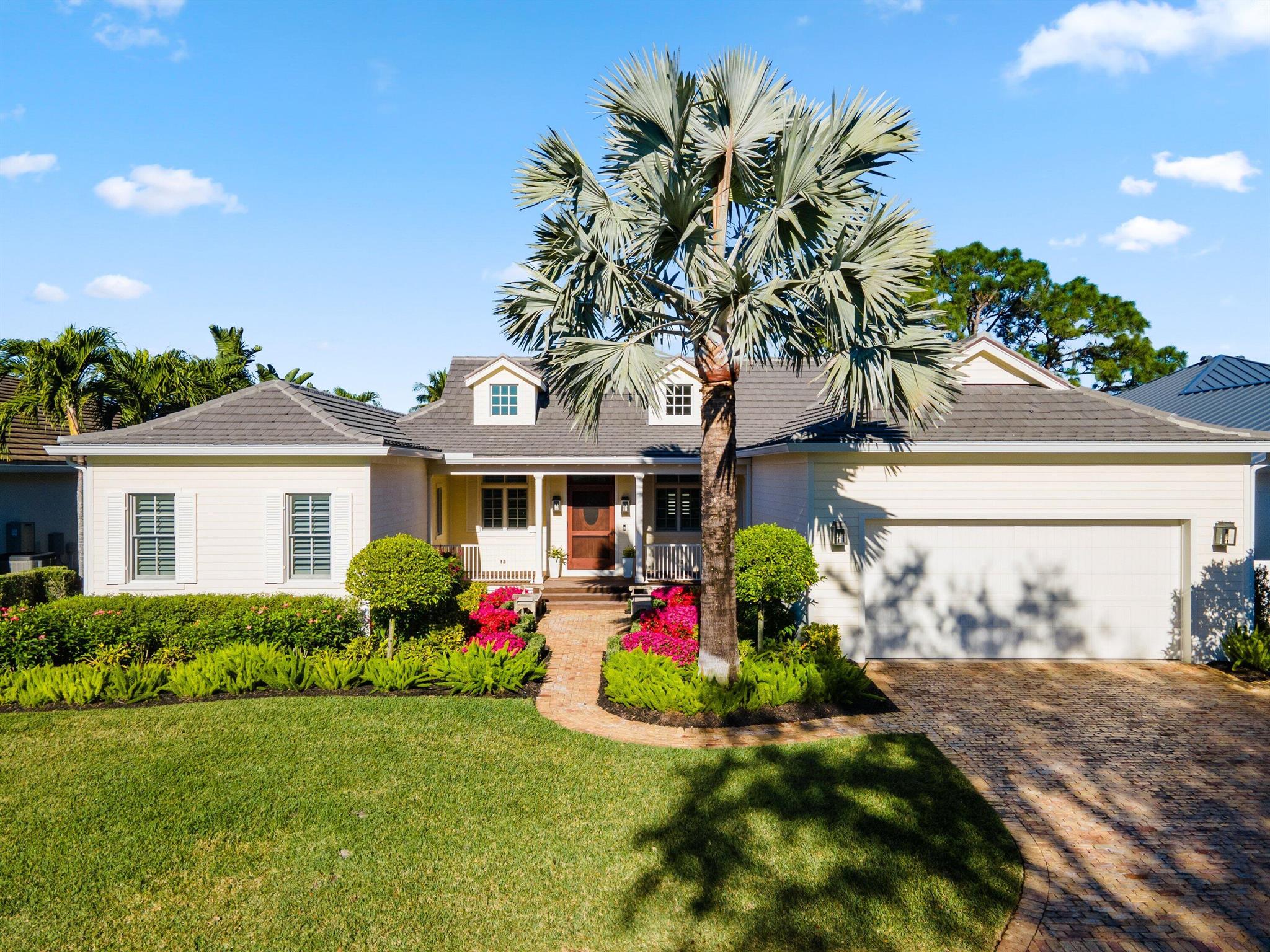 You can soon be enjoying this stunning home within the prestigious Loxahatchee Club, one of Florida's finest private club communities, located in Jupiter, FL. Built in 2018, this beautifully designed home offers 2,439 square feet of living space, featuring 2 bedrooms, 2.5 baths, and approved architectural plans for a third bedroom addition. The third bedroom addition will also upgrade the powder room to a full bathroom with a shower. The windows and flooring for the expansion have already been purchased and are ready for installation, making this home easily and quickly improved to a 3 bedroom 3 bathroom home. The third bedroom has yet to be constructed - terms to be negotiated. Architectural plans have been prepared and are already approved by the HOA, and can be transferred to a buyer at closing. This presents a great opportunity to purchase an already stunning home and easily add significant value.   
Designed for both style and comfort, the open-concept layout showcases a grand living area with soaring ceilings and striking architectural beams. The chef's kitchen is a culinary masterpiece, featuring expansive quartz countertops, stainless steel appliances, and a generous center island. The primary suite offers a cozy sitting area, dual closets, and a spa-inspired ensuite bath. A separate guest suite with a private bath ensures comfort and privacy for visitors. Step outside to experience Florida living at its finest&#x14;relax on the covered lanai, take in the serene views, or cool off in the splash pool. This exceptional home offers a perfect balance of elegance and tranquility in one of Jupiter's most sought-after communities.
Each day offers a variety of activities and world-class amenities. Whether you're headed to the state-of-the-art fitness center, enjoying a spa treatment, or a refreshing swim, the Loxahatchee Club caters to your every need. The Signature Jack Nicklaus design offers a challenging and playable experience. After a day on the greens or the courts, explore the diverse dining options available within the community, from casual bites to gourmet culinary experiences, all just a short golf cart ride away. At the Loxahatchee Club, you're not just buying a home; you're embracing a lifestyle of unparalleled luxury and community. Explore the possibilities and envision making this your sanctuary, where every day feels like a vacation.