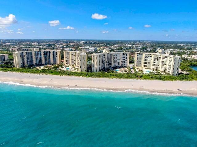 Welcome to Unimpeded Beach Access! That's right! Ocean Trail is the ONLY Jupiter condo community with NO street between it and the beach. This cute cozy 2 bed 2 bath beachfront condo comes fully furnished with a Jaguar S-Type 4 door sedan. With a balcony almost 30 ft long you can enjoy the early morning breezes and your morning cup of coffee during the sunrise. The enormous pool deck is fit for a 4 start resort guest. And if you want a wonderful resort for your guests you've got the Jupiter Beach Resort next door with private access from Ocean Trail. With eastern and western sunlight flowing through the condo along with the ocean breezes, you've got the beach in the palm of your hands. Plus, you're in the immediate proximity of the best new restaurants and classic mainstays that Jupiter