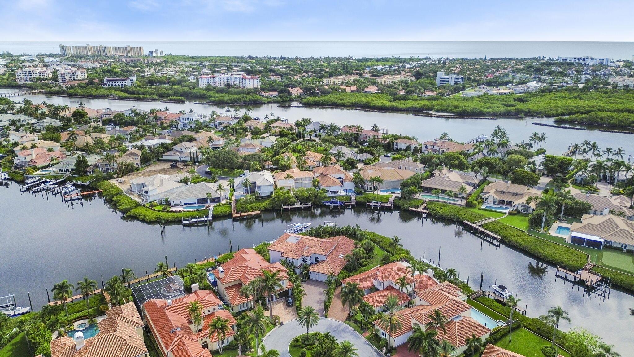 Welcome to 3299 Bridgegate Drive, a meticulously renovated deep waterfront pool home in the prestigious Jonathan's Landing Country Club, Jupiter Florida. This expansive 5-bedroom residence, plus an office or potential 6th bedroom, offers 6.5 bathrooms and exudes luxury and sophistication at every turn. Designed with both elegance and comfort in mind, the home features a thoughtfully crafted floor plan filled with natural light that seamlessly connects formal and casual living spaces, making it perfect for grand entertaining or serene family gatherings. The gourmet kitchen is truly the heart of the home, boasting ultra high-end appliances, custom cabinetry, and an expansive island that provides ample space for culinary creations and casual dining. The luxurious owner's suite is a private oasis, complete with two walk-in closets, an en-suite bathroom with dual vanities, an air tub, and a separate steam aromatherapy shower. Start your day with a moment of tranquility on your private patio, savoring your favorite morning beverage. The home also offers four additional spacious bedrooms, each with its own en-suite bathroom, ensuring comfort and privacy for family and guests alike. The office, or optional 6th bedroom, also includes an en-suite bathroom, making it a versatile space that can adapt to your needs.

This home is a showcase of exceptional features, including all impact windows and doors, a brand-new raised seawall leveling the backyard, and a new dock that can accommodate an 80-foot-plus boat. The property is equipped with two 24,000-pound boat lifts, a refinished saltwater pool with a new heater, pump, auto-fill, and auto-drain system, four new coastal Trane air conditioners, three new water heaters, a whole-house generator, and a 1,000-gallon propane tank. Bathrooms in the home are outfitted with steam showers featuring aromatherapy and or separate air tubs. Enhance an evening with a wood-burning fireplace, adding to the luxury experience.

Outside, the Florida lifestyle unfolds before you with breathtaking water views from your own backyard. Take a dip in the pool, relax in the spa, or enjoy the spacious green areas. With direct access to the water, your private dock offers endless possibilities, whether it's boating, jet skiing, or paddleboarding.

This is a rare opportunity to own a piece of paradise in Jonathan's Landing, a country club community where membership is optional, not mandatory. Conveniently located near I-95, the Florida Turnpike, Palm Beach International Airport, and premier shopping and dining, this home seamlessly combines luxury living with everyday convenience. Don't miss your chance to make 3299 Bridgegate Drive your new home&#x14;schedule a private showing today and experience the pinnacle of Jupiter living. Additional features include a 2019 roof, cul-de-sac location, and no fixed bridges.