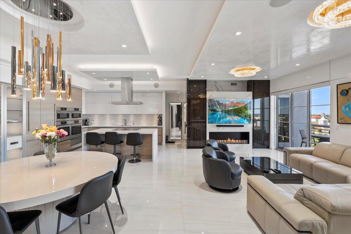 Experience the pinnacle of luxurious urban living in the heart of downtown Boca Raton with this impeccably crafted residence, completed in the summer of 2020. A masterpiece of contemporary elegance, this home offers a seamless blend of sophistication, functionality, and comfort.Step inside to discover a spacious layout featuring three well-appointed bedrooms and three luxurious bathrooms. The open-concept great room is the epitome of modern design, adorned with expansive porcelain tile flooring, soaring 10-foot ceilings, and custom-built wall units. Venetian plaster tray ceilings add an additional layer of refinement, while motorized blinds, including blackout options in all bedrooms, ensure privacy and convenience. Built-in cabinetry and wall treatments throughout enhance both form and function, creating a cohesive and stylish living environment. A Sonos sound system, integrated throughout the home, delivers a premium audio experience, perfect for relaxation or entertaining.

The gourmet kitchen is a culinary dream, outfitted with marble countertops, dual Bosch appliances&#x14;including two wall ovens, combo microwave ovens, and dishwashers&#x14;and sleek Italian Tizzoni Cucine cabinetry. Perfect for both entertaining and daily convenience, this kitchen redefines sophistication and functionality.

Step out onto the expansive covered balcony with northern exposure, where panoramic views of downtown Boca Raton and the ocean provide a stunning backdrop from sunrise to sunset.

Located in the prestigious Tower 155, this residence offers unparalleled access to Boca Raton's vibrant lifestyle, with Mizner Park, fine dining, luxury shopping, and cultural attractions just steps away. Exclusive building amenities include a resort-style pool, a spa with a steam room and sauna, a fitness center, and a rooftop patio complete with a bar, grills, jacuzzi, and breathtaking city views.

With privacy, security, and unmatched elegance, this is more than a home it's a lifestyle. Possible Owner Financing is available.