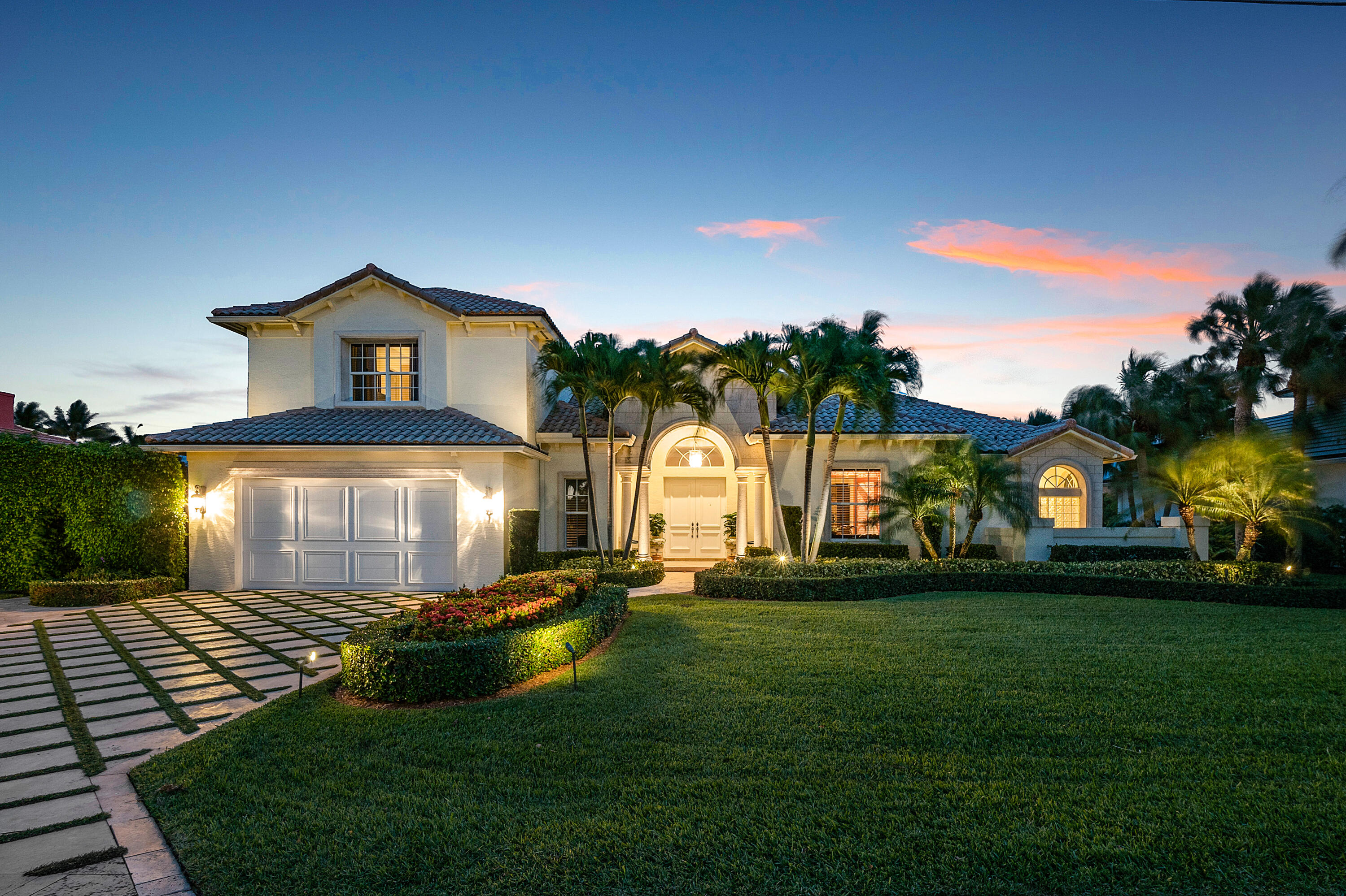 Nestled on one of the many island communities in Ocean Ridge, this stunning home defines the Florida Lifestyle. A desired eastern exposure, this deep water custom home with a 100-foot dock and a 16,000 pound boat lift is a yachtsman's dream. The outdoor entertaining area spills into this majestic home, making this the ultimate place for entertaining. The home boasts a large living area, high-end finishes, fireplace, office, and beautiful pool area, including pool, spa, outdoor shower, and cabana bath. Master suite is located on the lower level and there are 2 guest suites on the second floor with a large balcony with a beautiful view. This home is immaculate and ready for even the most discerning buyer.