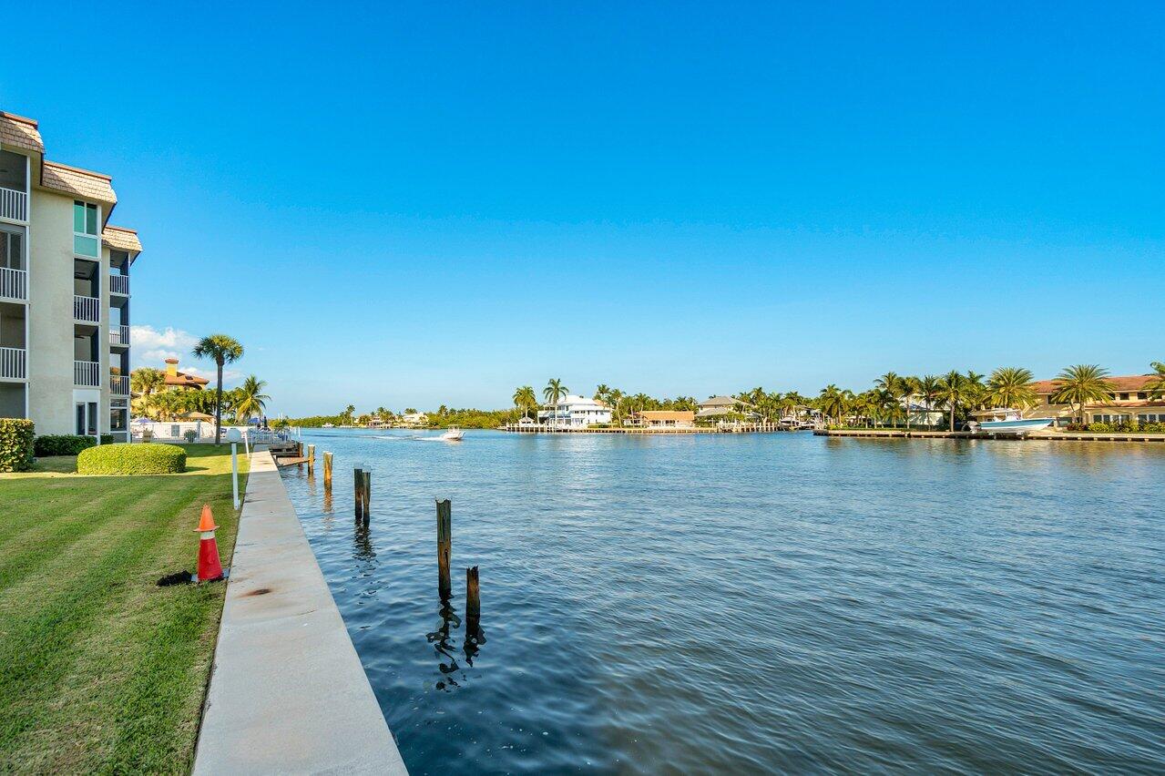 Experience the charm of this Beautifully Furnished 2-bedroom, 2-bath condo in a sought-after Intracoastal community! Enjoy resort-style living with a sparkling waterfront pool and clubhouse, perfect for soaking in the South Florida lifestyle. Whether you're looking for a seasonal retreat or year-round affordability, this condo is move-in ready--just bring your swimsuit! Features include HURRICANE WINDOWS, Enclosed Porch, Spacious Walk-in closet and Extra Storage for your toys. Snug Harbor is a 55+ community offering a community area, clubhouse, and Intracoastal pool offering breathtaking water views. It is conveniently located near shopping, dining, and just a bike ride to the beach, or walking distance to Shops and Restaurants.  If your going to live in Florida, Live on the water!