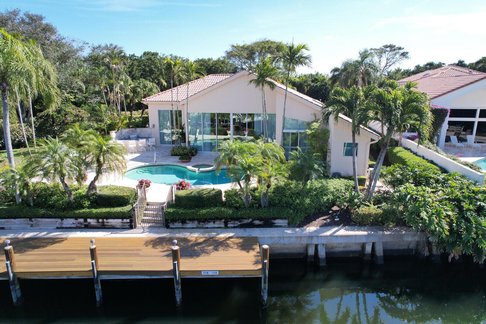 Magnificent Home in Frenchman's Creek! Rare, extra wide private.42 acre lot on deep water. Room for 2 boats. Easy access to the Intracoastal and the ocean.New 13' tall Impact Glass! Golf and beach club too!