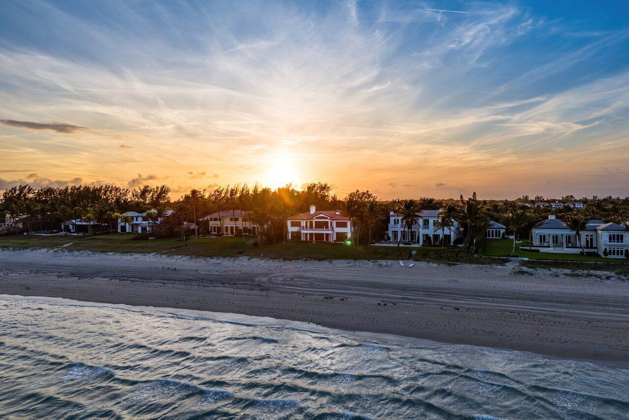 The wide stretch of tranquil blue ocean, pristine sandy beaches, lush green landscaping dotted with tropical palm trees are some of the attributes that define 3435 N. Ocean Blvd. Playful yet pragmatic, this superb coastal estate was completed with unsurpassed attention to detail and is sited on 100' of oceanfront in the exclusive town of Gulfstream. Featuring 8,359 TSF, 4 bedrooms, 4.1 bath main house and an attached guest house with a bedroom and bathroom. Upon entering, guests and family are greeted with wide-open spaces creating a balanced composition of expansive ocean views blended with floor to ceiling glass infusing the interior with abundant natural light. The first floor encompasses sweeping duel staircases an open living room, formal dining room, an ocean facing Guest suite, spacious office, and The first floor encompasses sweeping duel staircases an open living room, formal dining room, an ocean facing Guest suite, spacious office, and The epicurean master chef's kitchen features top-shelf appliances, /fine/custom cabinetry, large island with stone countertops. Adjacent to the kitchen is a casual dining area and an/inviting gathering room with sliding glass doors to the loggia and ocean. Offering the owner a sense of Zen within its doors, the second floor master retreat features wide ocean views plus a balcony, large walk-in closets, and a luxurious master bath. Two additional en-suite bedrooms and oversized lounge area complete the second floor.  Additional features include a gated entrance, a three-car garage, generator, and a fireplace just to name a few.  The harmoniously and flexible design creates a loving home that invites going barefoot, enjoying languid afternoons sipping mojitos or just enjoying the sound of the ocean, the smell of the sea salt and the glow of sunrise.  Family and guests enjoy easy access to a medley of fine dining, boutique shopping and top performing cultural events in Delray Beach and Palm Beach. Ready for the discerning buyer to enjoy the good life.