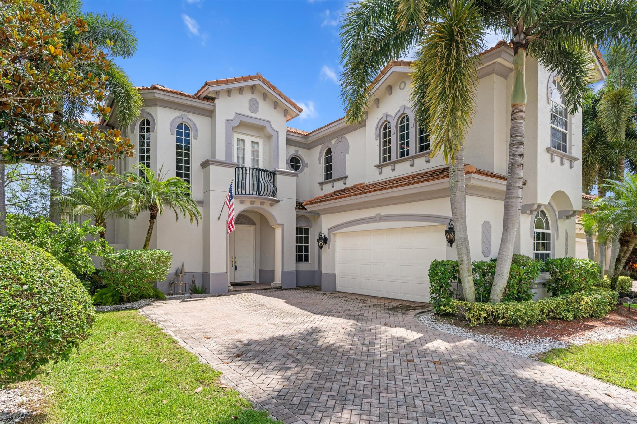 GORGEOUS WATERFRONT ESTATE | PRESTIGIOUS MIZNER COUNTRY CLUB | GOLF COURSE VIEWS 4TH HOLE | Lake Views & Fountain | Private Cul-de-sac | Grand Double Door Entry | Open Floor Plan | LED Recessed Lighting | Tile Floors | Impressive 23' Volume Ceilings | 2-Story Living Room | Double Tiered Windows | Arch Window | Gourmet Kitchen | Granite Counters | 42'' Cabinets | High-End S/S Appl | Primary Bed & Sitting Area | His/Her Walk-In Closets | En-suite Dual Sink Vanity | Walk-In Shower | Jacuzzi Tub | Loft | Manicured Landscape | Custom Pool, Hot Tub/Waterfall | Whole House Solar Panels | L/G Washer/Dryer | 3-Car GA +Golf Cart | Luxury Amenities | 18-Hole Golf Course, Tennis, Fitness Center, Fine Dining, Splash Pad, Lap Pool | PRESENT ALL OFFERS! Sale Excludes Foyer Light & Dinng Room Chandelier!