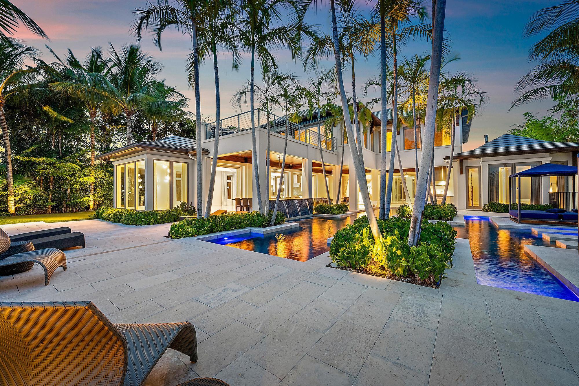 Live the ultimate waterfront lifestyle at 177 Commodore Drive. Dock your 94' yacht steps from your door, entertain effortlessly with a resort-style pool, putting green, and luxe outdoor lounges. Inside, 5 ensuite bedrooms, smart tech, designer touches, and an entertainer's kitchen define sophistication. All within Jupiter's prestigious Admirals Cove.  Admirals Cove offers an unparalleled lifestyle with world-class amenities: 45 holes of championship golf, 9 pristine tennis courts, and pickleball courts for year-round recreation. Indulge in resort-style relaxation with a spa, pool, and fitness center, or enjoy casual dining at 4 exquisite restaurants. With a vibrant dog park, playground, and a luxurious hotel, this exclusive community is where luxury meets leisure at every turn. Ultra-Luxury Contemporary Waterfront Estate - A Boater's Dream
Indulge in the pinnacle of modern waterfront living with this custom-designed contemporary estate, boasting over 120 feet of pristine water frontage. This architectural masterpiece offers 5 bedrooms, an office/den, and resort-inspired amenities, all meticulously crafted to deliver an unparalleled lifestyle of elegance and sophistication.

A Grand Entrance &amp; Resort-Style Outdoor Oasis
As you step through the front door, you are instantly transported to a luxurious private retreat, greeted by the breathtaking resort-style pool, spa, cascading water features, and multiple lounge areas&#x14;all designed for seamless indoor-outdoor living. Whether entertaining or unwinding, the covered and open loggias with custom Pecky Cypress ceilings, integrated TVs, water shelves, and a two-sided pop-up TV create an immersive experience of sophistication and relaxation.

Gourmet Chef's Kitchen &amp; Elegant Living Spaces
&#x14; Custom-designed chef's kitchen featuring dual islands, premium gas range, stainless refrigerator/freezer, and built-in cooling drawers
&#x14; Open-concept design, seamlessly overlooking the family and breakfast areas, perfect for casual dining or grand entertaining
&#x14; Expansive living areas filled with natural light, exuding a sense of warmth and refinement

Ultimate Owner's Retreat - A Sanctuary of Luxury
The primary suite is a true haven of tranquility, offering:
&#x14; A private gas fireplace for cozy ambiance
&#x14; Blackout shades for the ultimate restful retreat
&#x14; Stunning views of the resort pool and patio
&#x14; Expansive walk-in closets with custom organization
&#x14; Spa-inspired en-suite bath with dual vanities, a deep soaking tub, and an oversized walk-in shower

Exceptional Guest Accommodations &amp; Second-Level Retreat
&#x14; Main-floor guest suite with a private bath, perfect for VIP visitors
&#x14; Three additional guest suites on the upper level, each with a private en-suite bath
&#x14; Open-concept loft with a custom beverage station, ideal for relaxation and entertainment
&#x14; Second-floor library with glass doors and private balcony access, offering panoramic water views

A Boater's Paradise &amp; Outdoor Upgrades
This estate is designed for those who demand the finest waterfront lifestyle, featuring:
&#x14; Private dock with deep-water access, accommodating a large yacht
&#x14; Boat lift &amp; two jet ski platforms for effortless water adventures
&#x14; Electric sliding glass doors, seamlessly merging indoor and outdoor spaces
&#x14; Artificial turf putting green with bunker, perfect for golf enthusiasts
&#x14; Electronic retractable screens, ensuring year-round comfort
&#x14; Lush tropical landscaping, creating a serene private escape
&#x14; Two fireplaces, adding warmth and elegance to both indoor and outdoor spaces

Built with top-of-the-line materials, superior craftsmanship, and well-thought-out design, this extraordinary estate delivers the ultimate in luxury living. Don't miss this rare opportunity to own a one-of-a-kind waterfront retreat in a prestigious setting.