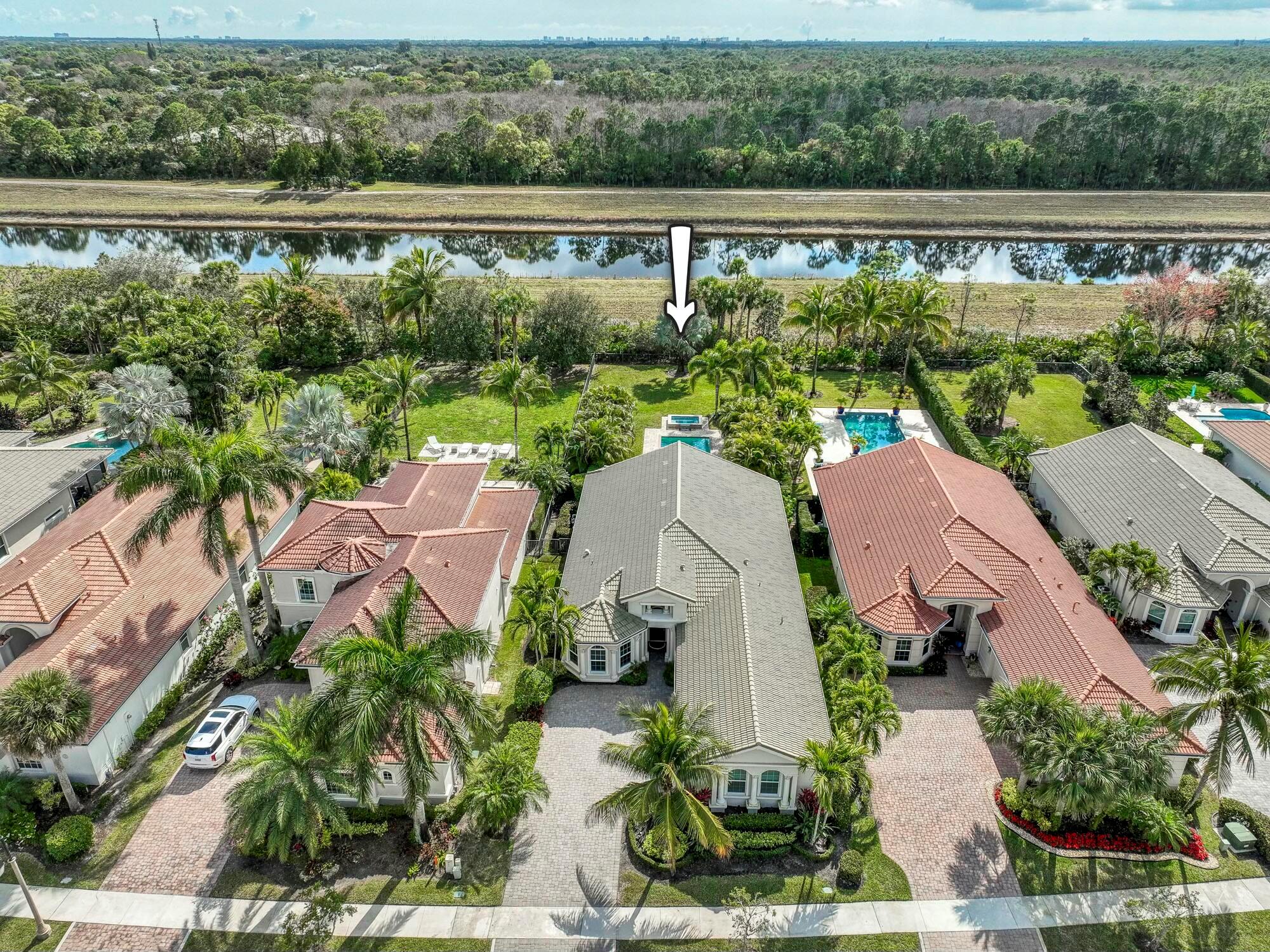 Live luxuriously & comfortably in this single-level extended Salerno model with an ULTRA PRIVATE homesite on almost 1/3 ACRE in the resort-style gated community of Jupiter Country Club. This open floor plan boasts 3 bedrooms, 2 1/2 baths, an office/den and a 3 CAR GARAGE. This home is luxuriously appointed and provides all the essentials of easy Florida living with impact glass windows, CBS construction, solid core doors, natural gas, and a UV air purification HVAC system. Upgraded with Control4 smart home automation throughout for lighting, indoor & outdoor speakers, doorbell camera and security cameras. Immerse yourself in the ultimate outdoor oasis with an expansive saltwater pool & spa with waterfall, all surrounded by mature and lush tropical landscaping. There is plenty of space to add a putting green or a summer kitchen gazebo to the huge lawn area. Relish the colorful sunsets and the serene views of Riverbend Park from the covered patio or pool deck. The south facing rear exposure provides loads of natural light into the home through the large impact sliders and transom windows. The grand custom arched solid wood front door welcomes you into the into the home with immediate views of the turquoise pool and tree-lined preserve. The great room is adorned a spectacular chandelier, surround sound in-ceiling speakers, crown molding and gorgeous Saturnia marble flooring. Channel your inner chef in the kitchen featuring solid wood white cabinetry with pull out drawers, a large center island, dual-temperature wine refrigerator, under-sink water filtration system, gas cooktop, sleek vent hood and lovely granite countertops + backsplash. The primary suite is truly a retreat featuring a myriad of upgraded windows with motorized shades, two walk-in closets with built-ins and a spa-like primary bath with dual vanities, a makeup area, walk-in shower with frameless glass enclosure &amp; dual shower heads, and a large whirlpool soaking tub. Enjoy your music in the primary bedroom and bath which also have been upgraded with in-ceiling speakers. Your guests will rest comfortably in the 2 spacious guest bedrooms. The office/den boasts rich hardwood flooring and can double as a convertible 4th bedroom. The coveted 3 car garage has been upgraded with epoxy flooring and built-in storage. Jupiter Country Club is a luxury gated community conveniently located within close proximity of I-95 and the FL Turnpike, beaches, shopping, restaurants, parks &amp; nature preserves. Club amenities &amp; events offer a plethora of social opportunities and include a Greg Norman Signature golf course, 2 resort-style pools, the Sway restaurant &amp; bar, a state-of-the-art fitness center + yoga/mat pilates/barre group fitness classes, massage/facial treatment services, tennis, bocce ball, pickle ball &amp; basketball. Members enjoy reciprocal privileges to Invited Clubs worldwide. Live your best life here!