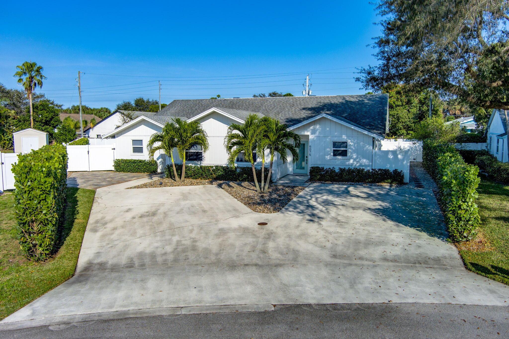 Gorgeous duplex currently operating as a successful AirBnB, VRBO property. 6 bedrooms, 5 full baths in 2 units. One is a 3/3 with 2 primary bedrooms and ensuite baths. It generates $400 per night during season. The other unit is a 3/2 and generates $350/night. Fully furnished and turnkey! Complete hurricane impact windows and doors for piece of mind. Entire property is privacy fenced with low maintenance PVC fencing. North unit (6077 the 3/3) has double wide gate for small boat storage, huge yard for pets & kids! Open floor plan is light and bright! Doorway could be opened between the units to create a 6/5 single family home and to help accommodate many multi-generational living arrangements while maintaining a level of independence. It's only steps to Abacoa & Alton community activities!