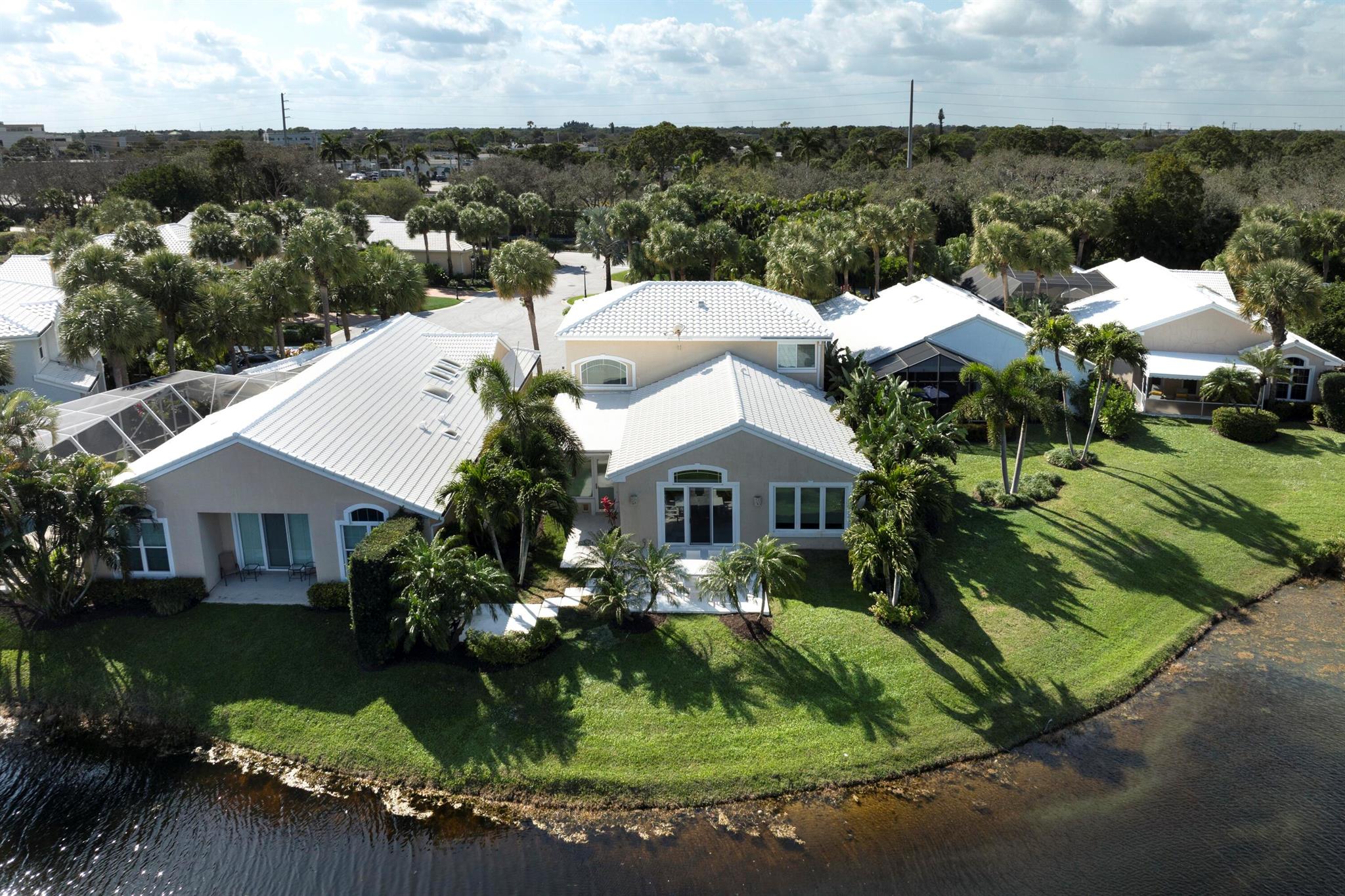 Experience Coastal Living at its finest! This 3-bedroom, 2.5-bath, 2 story home is nestled in sought-after, Bridgegate, in the gated community of Jonathan's Landing. The home is being offered fully furnished and move-in ready! The open-concept design provides a bright and inviting space and recently renovated patio overlooks the serene lake. Start your mornings with breathtaking sunrise views, enjoy a round of golf, take a stroll along the nearby beach just minutes away, or set out for an unforgettable South Florida fishing adventure. This exceptional lifestyle has something for everyone!Jonathan's Landing offers club membership (not mandatory), providing access to world-renowned Fazio-designed golf courses, fitness center, tennis, dining, dog park, playground and marina. LARGE DOGS OK!