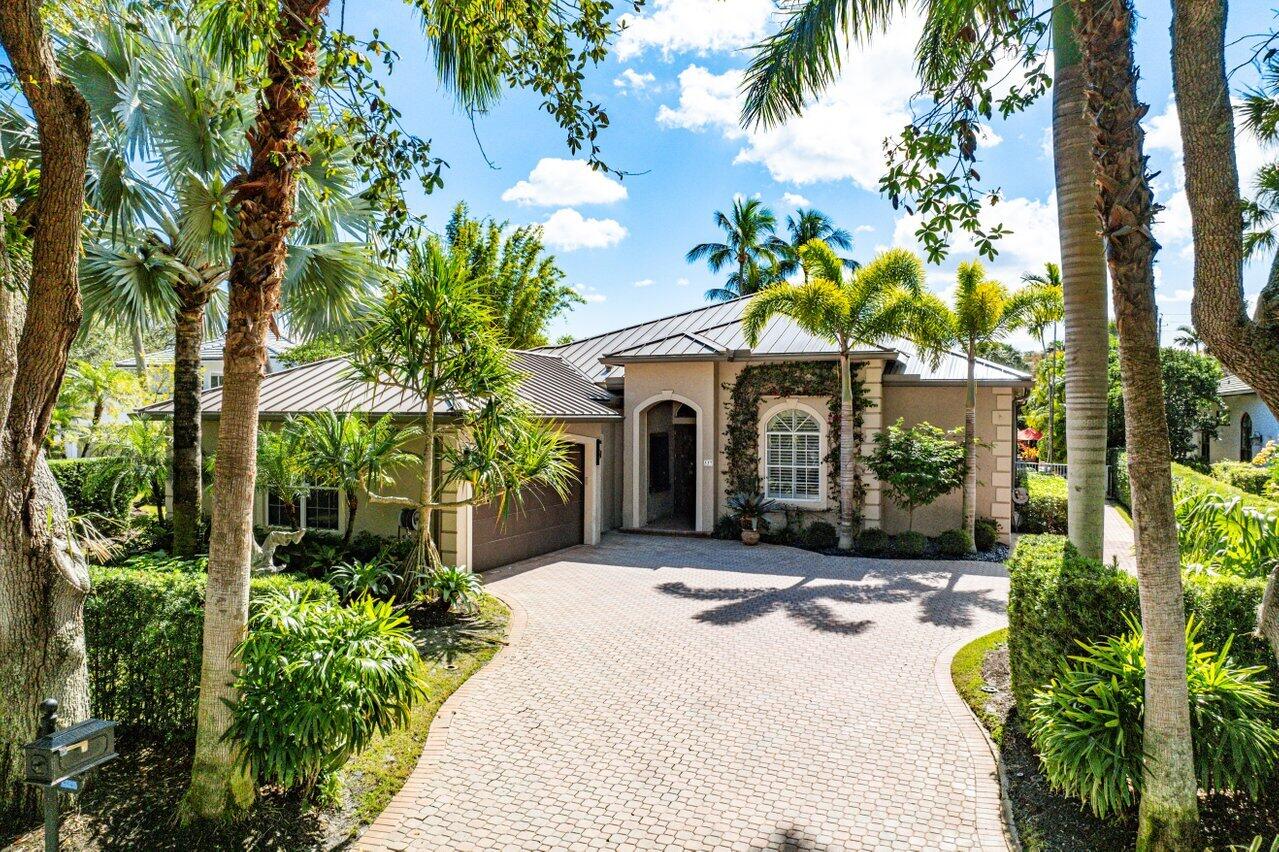 One's entry through the front foyer into the living room is immediately greeted by breathtaking views of the beautifully expansive backyard, creating a seamless connection between indoor and outdoor living.  An oversized pool & spacious patio area are perfect for both relaxing and entertaining, surrounded by lush tropical landscaping that provides privacy and serenity.  Dining room features a built-in bar w/ under-lit onyx countertops, large wine refrigerator & custom wood cabinetry.  The luxurious primary suite includes dual baths and walk-in closets.  Open-concept kitchen boasts high-end stainless steel appliances & custom wood cabinetry. A nicely appointed family room adjoins the kitchen.  New, metal roof installed within the past year.  Home  beautifully renovated throughout. Home also has a flow logic system.

Admirals Cove is the premier club and waterfront community in the Palm Beaches.  It's amenities include 45 holes of golf (more holes of golf per member than most Florida club communities), a fully staffed Marina, hardtrue tennis courts, pickleball courts, two clubhouses, state of art fitness, spa and salon, boutique hotel for members and their guests, multiple dining venues ranging from outdoor casual overlooking the waterway to formal clubhouse dining, year-round children's activities and facilities, on-site banking, a highly professional staff, and a membership that readily embraces new Admirals Cove residents and members.