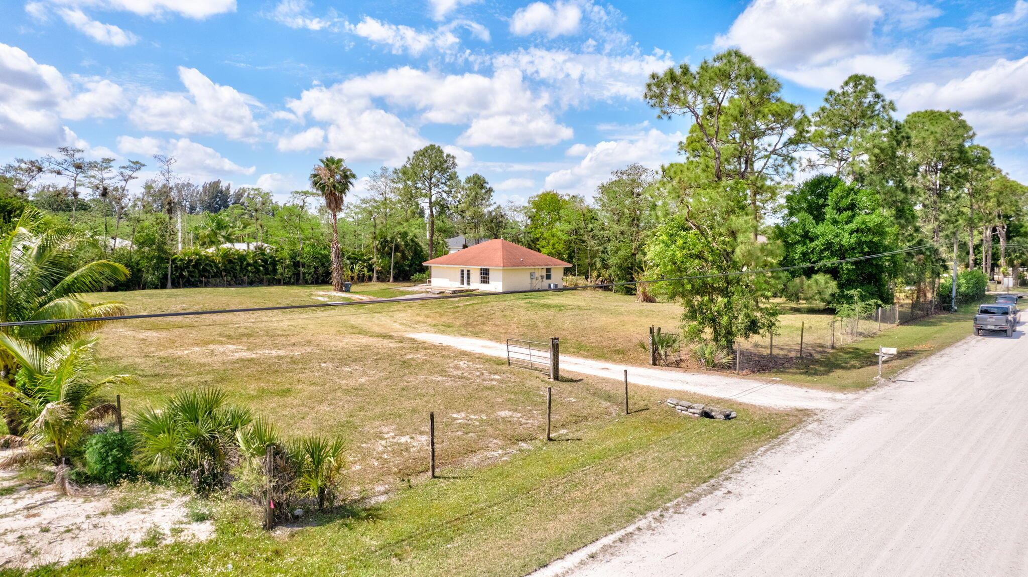 BEAUTIFUL 2015-BUILT 2-BED, 2-BATH HOME ON 1.14 ACRES - NO HOA - BRING YOUR BOATS, HORSES & RVS - LOXAHATCHEE! Enjoy privacy just 15 mins from the Palm Beach International Equestrian Center & Polo Club, and 2 blocks from Westlake shopping, dining & entertainment. Less than 20 miles to beaches & airport! Includes a compacted, elevated pad ready for a barn or workshop (verify with Palm Beach County). Surrounded by top-rated schools in a growing area with exciting new developments. Don't miss this amazing opportunity!
